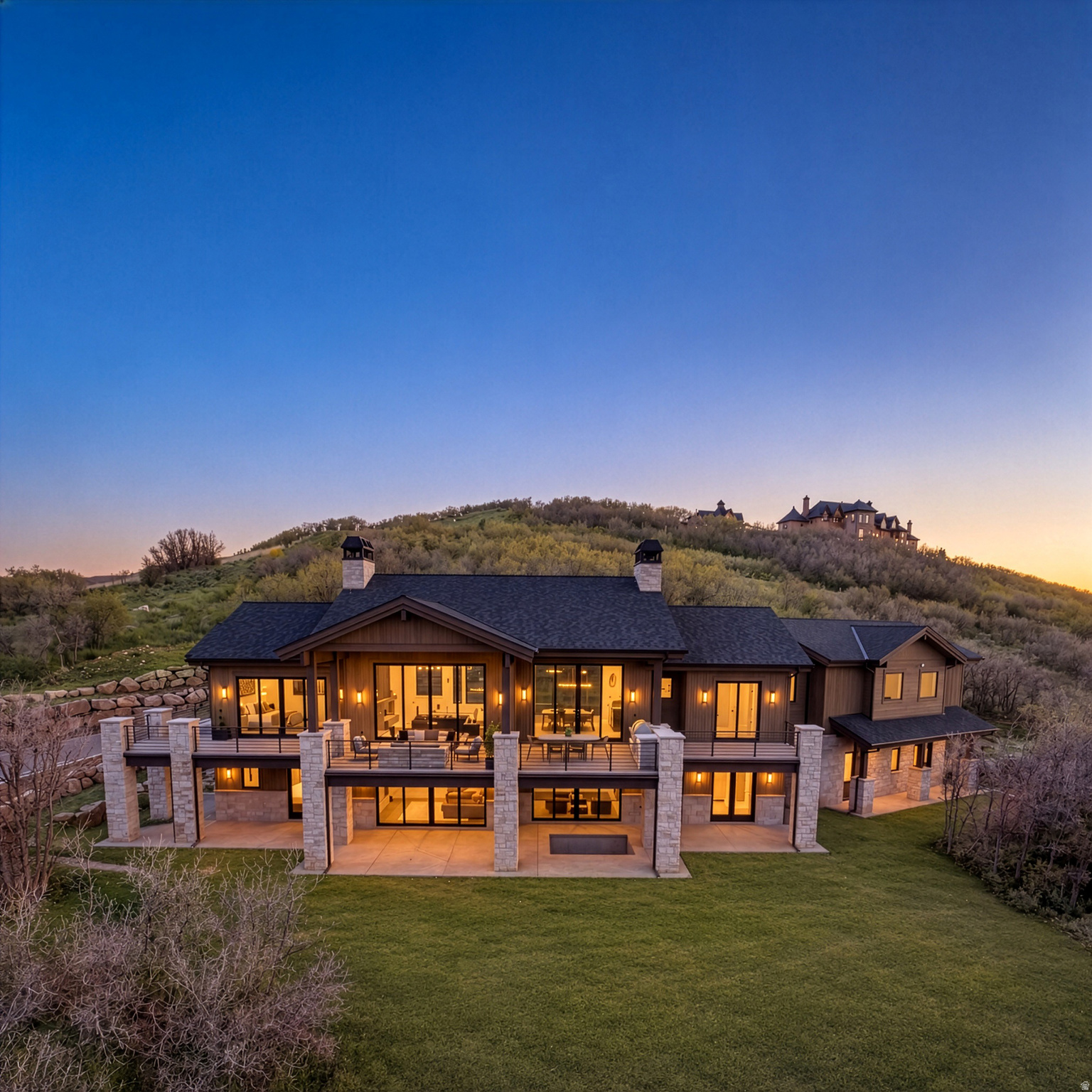 Set behind the gates of Ranches at the Preserve, this newly completed mountain estate offers a rare combination of privacy, acreage, and sweeping panoramic views just minutes from Park City. Positioned on 10.7 acres, the home captures breathtaking 210-degree views spanning Deer Valley, Park City Mountain, and the Uinta Range, creating a true sense of escape while remaining close to world-class skiing, dining, and shopping.  Designed with timeless mountain-modern architecture, the residence blends limestone, steel, glass, and warm natural finishes to create a home that feels both sophisticated and connected to its surroundings. Spanning 6,522 square feet, the thoughtfully designed floor plan offers expansive indoor-outdoor living spaces framed by mountain views from nearly every room.  The chef's kitchen opens seamlessly to the main living area, anchored by a dramatic limestone fireplace and walls of glass leading to expansive decks and covered patios. Outdoor living is equally inviting with serene entertaining spaces, abundant wildlife, unforgettable sunsets, and a private inground spa. The main-level primary suite is a private retreat with panoramic views and direct access to the deck. The spa-inspired bath features a soaking tub with mountain views, spacious steam shower, heated floors, and heated towel bars.  The lower level is designed for guests and entertaining, featuring all guest suites, a spacious game room with TV lounge, games, wet bar, 500-bottle wine cellar, and walkout access to the covered patio, hot tub, and flat lawn.  With 5 bedrooms, 6.5 bathrooms, bunk retreat, fitness area, 3-bay garage, and heated driveway, the home offers exceptional comfort and flexibility. Ranches at the Preserve also allows for a guest house, barn, and caretaker's cottage, with horses permitted-offering the opportunity to create a true legacy compound. A rare offering combining architecture, land, views, and privacy in one of Park City's most extraordinary settings.