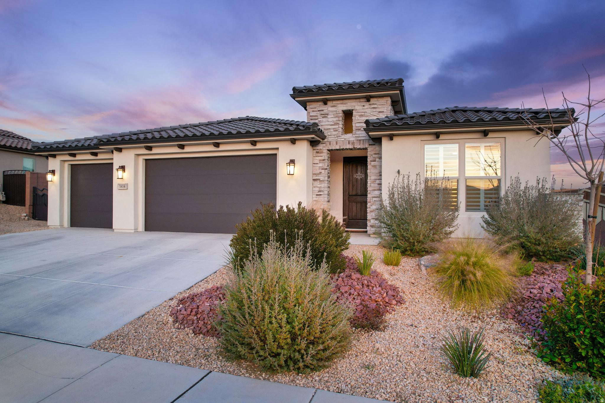 Located in the Estates section of Brio, this 2022-built Onyx floor plan sits on a rare .38-acre lot with no neighbors behind, offering privacy and space that is hard to find in the community.  The single-level home features 3 bedrooms, 2.5 baths, and a 3-car garage, with an open layout designed for comfortable everyday living. Interior highlights include a gourmet kitchen with granite countertops, double wall ovens, upgraded cabinetry with soft-close drawers, premium laminate flooring, plantation shutters, and tiled shower surrounds with frameless glass.  The backyard is fully enclosed with block wall fencing and includes an extended concrete patio and grass area, plus a large unfinished section that offers excellent potential for RV parking, storage, additional landscaping, or future improvements.  Located within Brio, residents enjoy resort-style amenities including indoor and outdoor pools, fitness center, pickleball courts, tennis courts, clubhouse, and event space-all surrounded by Southern Utah's red rock scenery and outdoor lifestyle.
