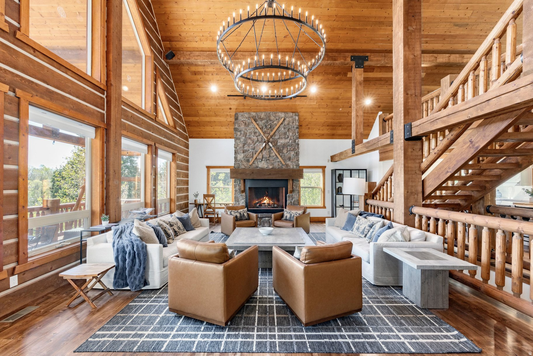 Unique Opportunity & Incredible Value! Nestled in the peaceful surroundings of Tollgate Canyon just outside Park City, this custom home offers a perfect blend of elevated luxury, convenience and serene mountain living. Just off I-80, minutes from Park City and a direct 45 minute commute (all hwy no lights) to the SLC Int'l Airport, this stunning retreat feels worlds away while remaining conveniently close to everything.  Beautifully renovated and fully furnished, this custom home is the definition of a true turn-key retreat. Thoughtfully redesigned with high-end custom finishes throughout, the home showcases a bright, elegant kitchen equipped with premium Wolf and Sub-Zero appliances. Designer-curated interiors feature custom-made furnishings that perfectly complement the home's refined aesthetic. The bathrooms have also been extensively remodeled, with updates completed as recently as 2026, offering a fresh and modern feel throughout. Expansive windows and soaring ceilings showcase breathtaking mountain views and create a warm, inviting atmosphere centered around a dramatic two-story stone fireplace.  Impressive 10'+ ceilings throughout the entire home. Built-in, heated two-car garage with an EV charging station.  Enjoy summer evenings and the surrounding natural beauty from the back deck or patio, taking in the expansive mountain vistas and visits from local wildlife.  With year-round access, conveniently enjoy the beauty of all 4 seasons. Whether as a luxurious full-time residence or an exceptional mountain retreat, this is a property that must be experienced in person. The home sits on a 1.08 acres, sandwiched between two additional parcels included in the list price, providing flexibility for future use. Parcels are not yet combined, so buyer may build on and/or sell off the two additional parcels, or combine all 3. *completed bathroom reno pics coming soon!