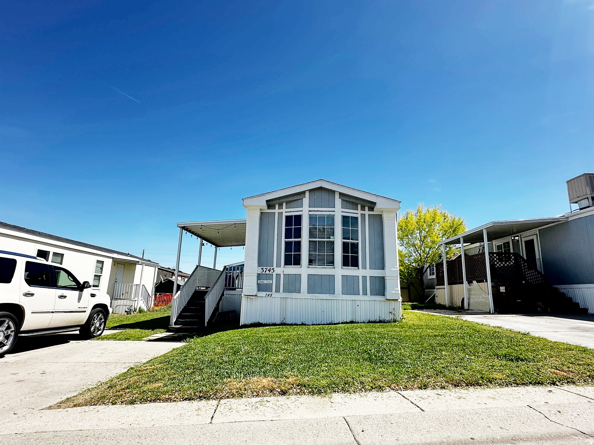 Charming 2-bedroom, 1-bath mobile home in Magna offering comfortable and affordable living with a functional layout, bright living spaces, and plenty of natural light throughout. The home features a spacious living area, well-sized bedrooms, and a kitchen with ample cabinet space perfect for everyday living. Conveniently located near Walmart, Smiths, restaurants, parks, and major highways.   Square footage figures are provided as a courtesy estimate only and were obtained from County Records.  Buyer is advised to obtain an independent measurement.