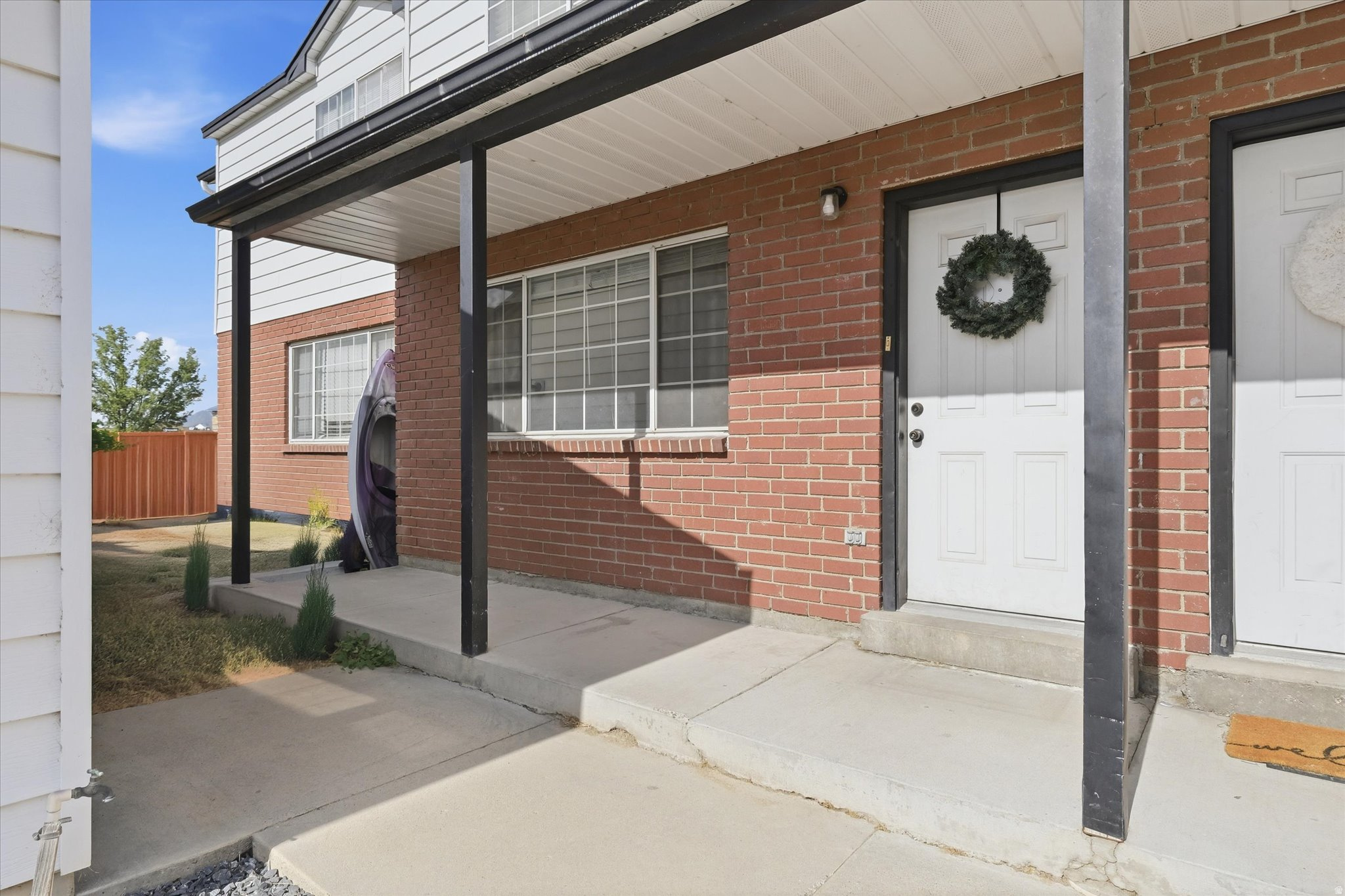 **Why rent when you can own?** This charming Logan townhome is a wonderful opportunity at an affordable price point! Central Logan location near shopping, schools, and everyday amenities, this 3-bedroom, 1.5-bath home offers 1,116 sq. ft. of comfortable living space with a smart two-level layout.  The private fenced backyard create a great outdoor space, with a green area next door for an added sense of openness. HOA includes maintenance and snow removal, and pets are permitted.  Great central Logan location!  Come see how easy homeownership can be!