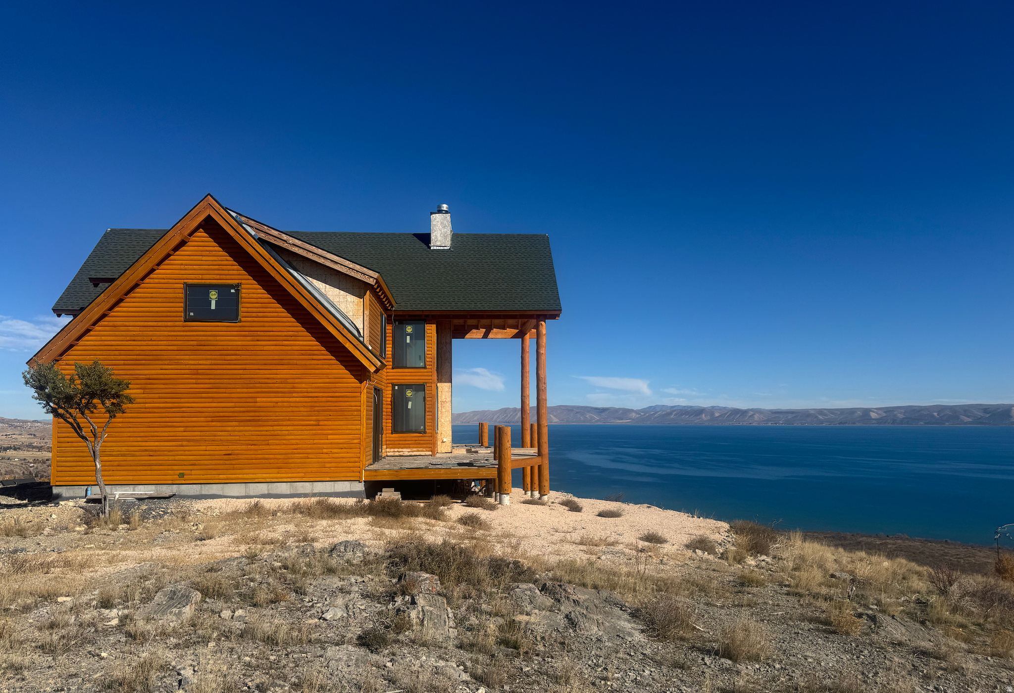 COME AND FINISH YOUR DREAM HOME WHERE "FOUR SEASON LIVING IS AT ITS FINEST!" UNOBSTRUCTED VIEWS OF BEAUTIFUL BEAR LAKE ON THIS SUPREMELY SITUATED SITE IN THE HIGHLY SOUGHT AFTER SWAN LAKE VILLAGE. PERCHED ATOP A MOUnTAIN RIDGE WITH GORGEOUS VIEWS OF BEAR LAKE TO THE EAST AND BEAUTIFUL MOUNTAINS TO THE WEST, THERE IS FUN TO BE HAD ALL YEAR LONG! JET SKIING, WATER SKIING AND A HOST OF OTHER WATER SPORTS, MOUNTAIN BIKING, ROAD BIKING, HORSEBACK RIDING, HIKING, SNOWMOBILING, ALPINE AND CROSS COUNTRY SKIING, ICE FISHING, FISHING (TROPHY SIZE CUTTHROAT AND WHITEFISH) SPELUNKING AT MINNETONKA CAVES. RASPBERRY DAYS FESTIVAL, THEATRICAL PRODUCTIONS AT PICKLEVILLE PLAYHOUSE, GOLF, RESTAURANTS, SHOPPING AND MORE! SQAN CREEK IS JUST MINUTES FROM THE NEW STATE MARINA/PARK AND HAS ITS OWN BEACH FRONT ACCESS WITH WATERCRAFT LAUNCH.