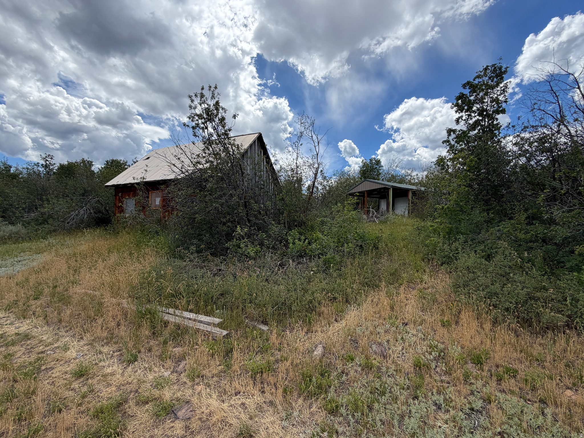 Awesome recreational property with two outbuildings already on it, ready to go! Located in the Bear Lake Ranchettes, north of Liberty/Sharon on Stauffer Canyon Rd, this 20 acre lot is an outdoor enthusiast's paradise! Good thick trees on the west of buildings for afternoon shade, and a pretty but distant view of Bear Lake, the mountains, and the valley all around. Property features an old sheepherder's cabin from early 1900's and a much more modern-built shed, with concrete floor, with covered porch area to enjoy the peace and quiet up in the hills! Full 20 acres is quite gradually-sloping, making it very usable for whatever a buyer desires. County does not plow road in the winter. Use GOOGLE Maps for GPS to locate with listed address. Final address to be determined by county upon building residence. This one really checks most every box, so jump on it ASAP!