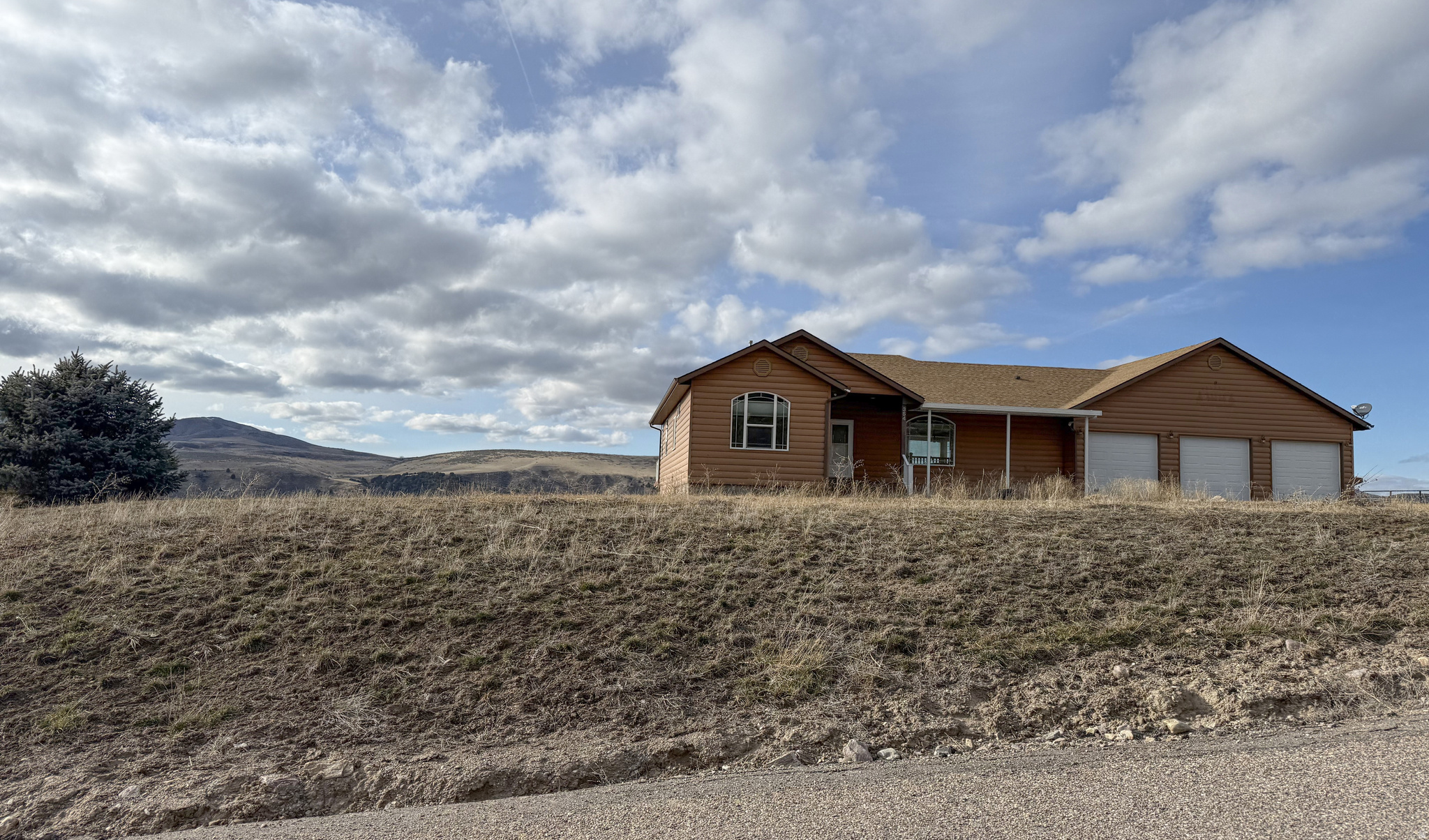 Experience exceptional privacy and panoramic mountain views on this stunning acreage property in Inkom. This custom-built home offers nearly 4,000 sq ft of living space with quality finishes throughout, including a spacious kitchen, open living areas, and large windows that capture the surrounding landscape. The home features 3 bedrooms, 3 bathrooms, a finished basement, and generous storage options. Set on over 16 acres, the property includes a 3 stall garage and a large 4 stall shop, providing ample room for vehicles, equipment, and recreational gear. Additional highlights include a wraparound deck, radiant heating, and a serene setting with year-round natural beauty. A rare underground rifle range and secure gun vault add unique value for the outdoor enthusiast. Located just minutes from I-15 access, this property combines seclusion with convenience-ideal for those seeking space, views, and a one-of-a-kind home in the heart of Southeast Idaho. BTVAI.