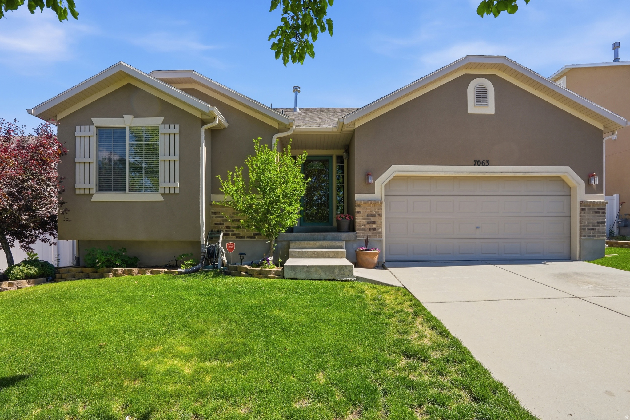 Beautifully maintained West Jordan rambler featuring 5 bedrooms, 3 bathrooms, and a functional layout designed for comfortable everyday living. With multiple bedrooms and flexible living spaces, this home offers room to gather, work from home, host guests, or simply spread out. The backyard is a true highlight a peaceful outdoor oasis with mature trees, a thoughtfully landscaped backyard, and a covered deck perfect for summer BBQs, quiet mornings, and relaxing Utah evenings. The outdoor space feels beautifully maintained, private, and inviting, offering the kind of setting that makes home feel like a retreat. Recent improvements include a brand new water heater and a newly completed basement bathroom, adding convenience and value. Located in a growing West Jordan area with easy access to Mountain View Corridor and Bangerter Highway, this home keeps you close to shopping, dining, parks, and everyday amenities while still offering comfort and calm at home.