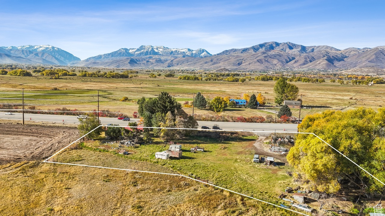 High Density Commercial/Res. Development parcel boasting 2.58 acres right off Highway 40 in the North Village Overlay District. Prime Visibility and Access.  There is expotential development ongoing in this area of the Valley.  MIDA (offering ski slopes), Harvest Fields, The Crossing all boasting maor amenities.  Only minutes to Park City.  Close to Jordanelle Res. and Provo River for world class fishing and recreating.  Offers great views of Mount Timp and surrounding Peaks.  Offers 6 ERU's per net acre making for an exceptional development or hold piece.  Don't miss this chance to own a piece of Commercial Real Estate in the rapidly growing Heber Valley.  Square footage figures are provided as a courtesy estimate only and were obtained from County Records.  Buyer is advised to obtain an independent measurement.