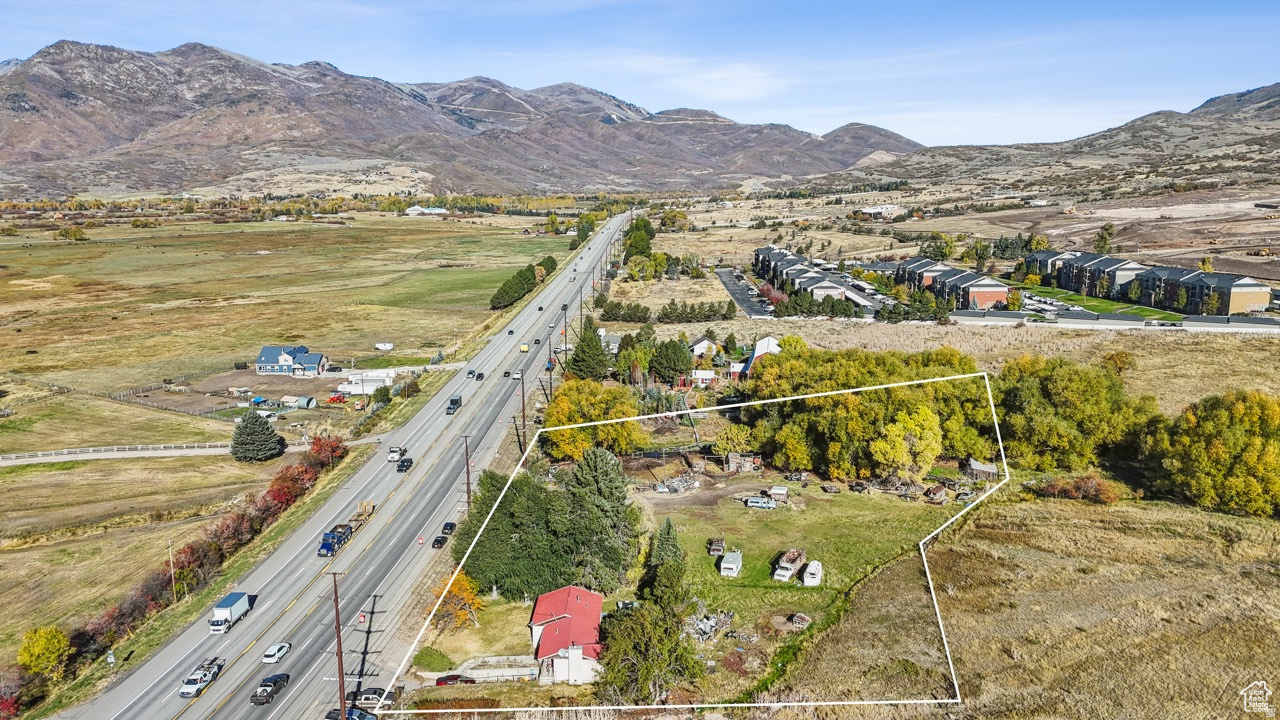 High Density Commercial/Res. Development parcel boasting 2.58 acres right off Highway 40 in the North Village Overlay District. Prime Visibility and Access.  There is expotential development ongoing in this area of the Valley.  MIDA (offering ski slopes), Harvest Fields, The Crossing all boasting maor amenities.  Only minutes to Park City.  Close to Jordanelle Res. and Provo River for world class fishing and recreating.  Offers great views of Mount Timp and surrounding Peaks.  Offers 6 ERU's per net acre making for an exceptional development or hold piece.  Don't miss this chance to own a piece of Commercial Real Estate in the rapidly growing Heber Valley.  Square footage figures are provided as a courtesy estimate only and were obtained from County Records.  Buyer is advised to obtain an independent measurement.