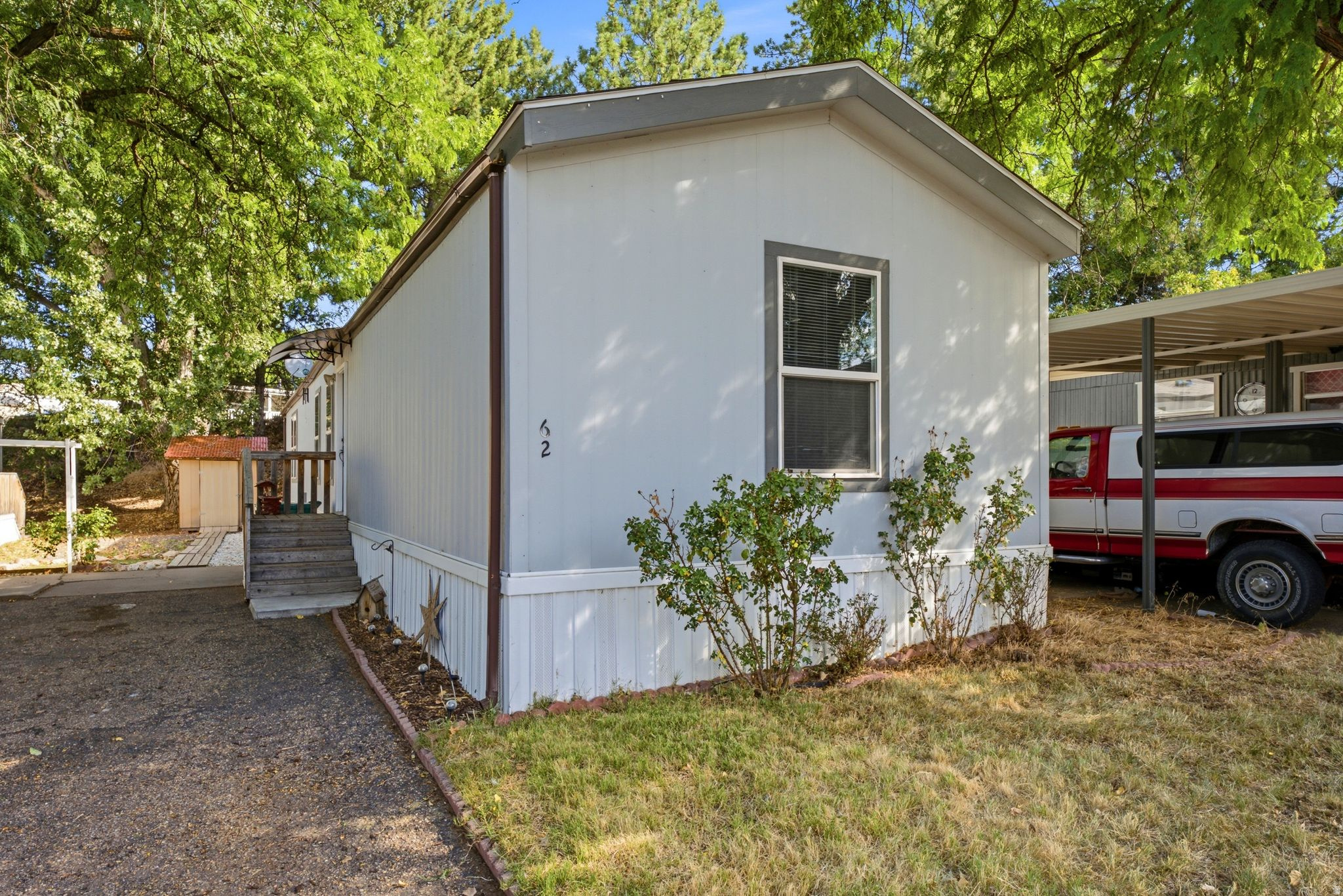This spacious 3-bedroom, 2-bath manufactured home offers a comfortable and functional open floor plan with plenty of room for everyday living. The bright kitchen flows seamlessly into the main living area, creating an inviting space for relaxing or entertaining. Ideally located across from the community's recreational area and green space, this home offers affordable, low-maintenance living in an established neighborhood. Conveniently located near Layton Hills Mall, shopping, restaurants, Hill Air Force Base, and with easy freeway access. Schedule your showing today! Square footage figures are provided as a courtesy estimate only. Buyer is advised to obtain an independent measurement. Please park only in the driveway or designated visitor parking when viewing the home.