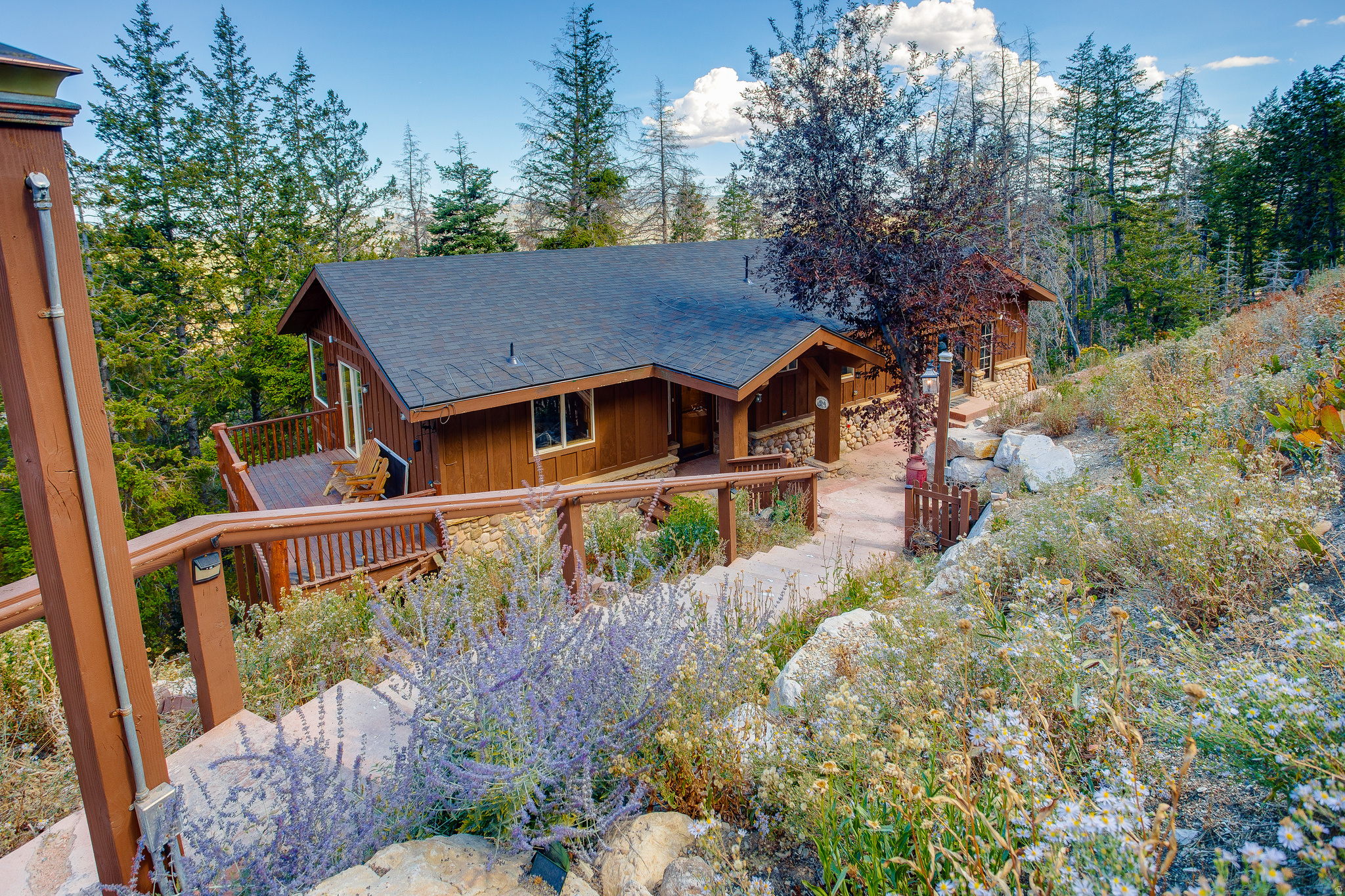 Offered fully furnished and thoughtfully upgraded for personal use, this turn-key mountain home in Summit Park delivers immediate enjoyment with major systems already completed. Recent improvements include a new roof, updated furnace, new water heater, new AC, radon mitigation system, and heat tape. Inside, the home has been refreshed with a remodeled living room and basement, new paint throughout, and updated finishes. The layout offers flexibility with multiple living spaces, 4 bedrooms, and seamless indoor-outdoor flow to surrounding decks. Large windows bring in natural light and enhance the connection to the surrounding landscape. This home is truly move-in ready! Ideal for a buyer looking for a second home or primary residence without the time and expense of furnishing and setup. Conveniently located just minutes from Park City's world-class skiing, hiking and biking trails, and with easy access to Salt Lake City, this is a rare opportunity to own a well-positioned, turn-key property where the heavy lifting has already been done.