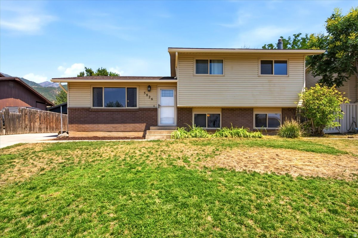Location, location, location. Desirable South Ogden area within walking distance to schools, parks and stores.  Move right into this affordable 4 bedroom, 2 bath home. Open floor plan with updated kitchen & paint, a cozy downstairs family room with wood burning stove, large 2 car garage w/ workbench and partially fenced backyard are just a few of the great things about this home. Come see if today before it's gone