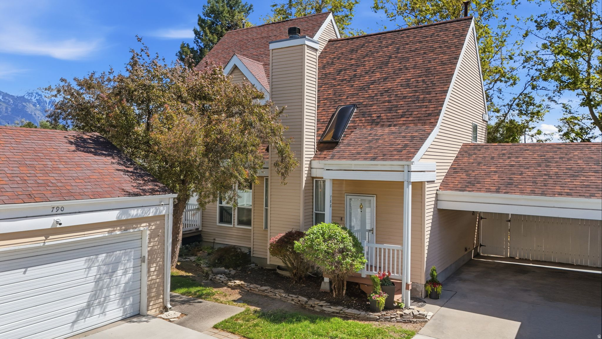 Charming cottage-style townhome nestled in a peaceful, tree-lined cul-de-sac community with convenient access to I-215. This thoughtfully updated home features fresh paint throughout, a private backyard, covered carport, and access to the community pool. The finished lower level provides additional living space with a family room, full bath, laundry area, and flexible rooms for guests, hobbies, or a home office. Recent improvements include a new roof and skylights installed just months ago. HOA dues are only $276/month and cover water, sewer, trash, snow removal, and pool access. Buyer and buyer's agent to verify all information and figures, which are provided as estimates based on county records.