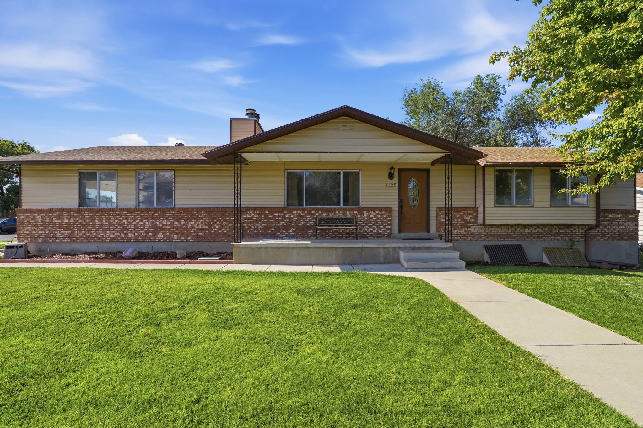 Welcome to this beautifully maintained 5-bedroom, 2-bath rambler offering over 2,200 square feet of comfortable living space on a spacious corner lot in one of Clearfield's most convenient locations. Nestled near the Clinton border, this home offers the perfect blend of an established neighborhood and easy access to everything Davis County has to offer.  Inside, you'll find a bright, functional layout featuring updated flooring, generous living spaces, and an open flow that's perfect for everyday living and entertaining. The spacious kitchen opens seamlessly to the dining area, while multiple gathering spaces provide plenty of room for family, guests, or a home office.  Step outside to the incredible oversized covered deck-perfect for summer BBQs, outdoor dining, or simply relaxing while overlooking the fully fenced backyard. This inviting outdoor space is ideal for entertaining or enjoying peaceful evenings at home.  Thoughtful updates include a newer roof, central A/C, water heater, and fresh interior improvements. One of the home's biggest highlights is the fully paid-off solar system, providing exceptional energy efficiency with seller-reported power bills often around just $20 per month, depending on usage-all without a solar payment to assume.  The location is hard to beat! Enjoy quick access to I-15, the West Davis Corridor, Hill Air Force Base, parks, schools, shopping, and dining. You're also just minutes from the new Syracuse Costco and the area's expanding retail and restaurant district, making everyday errands and commuting incredibly convenient.  With five spacious bedrooms, two bathrooms, a two-car garage, a generous corner lot, and move-in-ready condition, this home combines space, comfort, efficiency, and an unbeatable location.