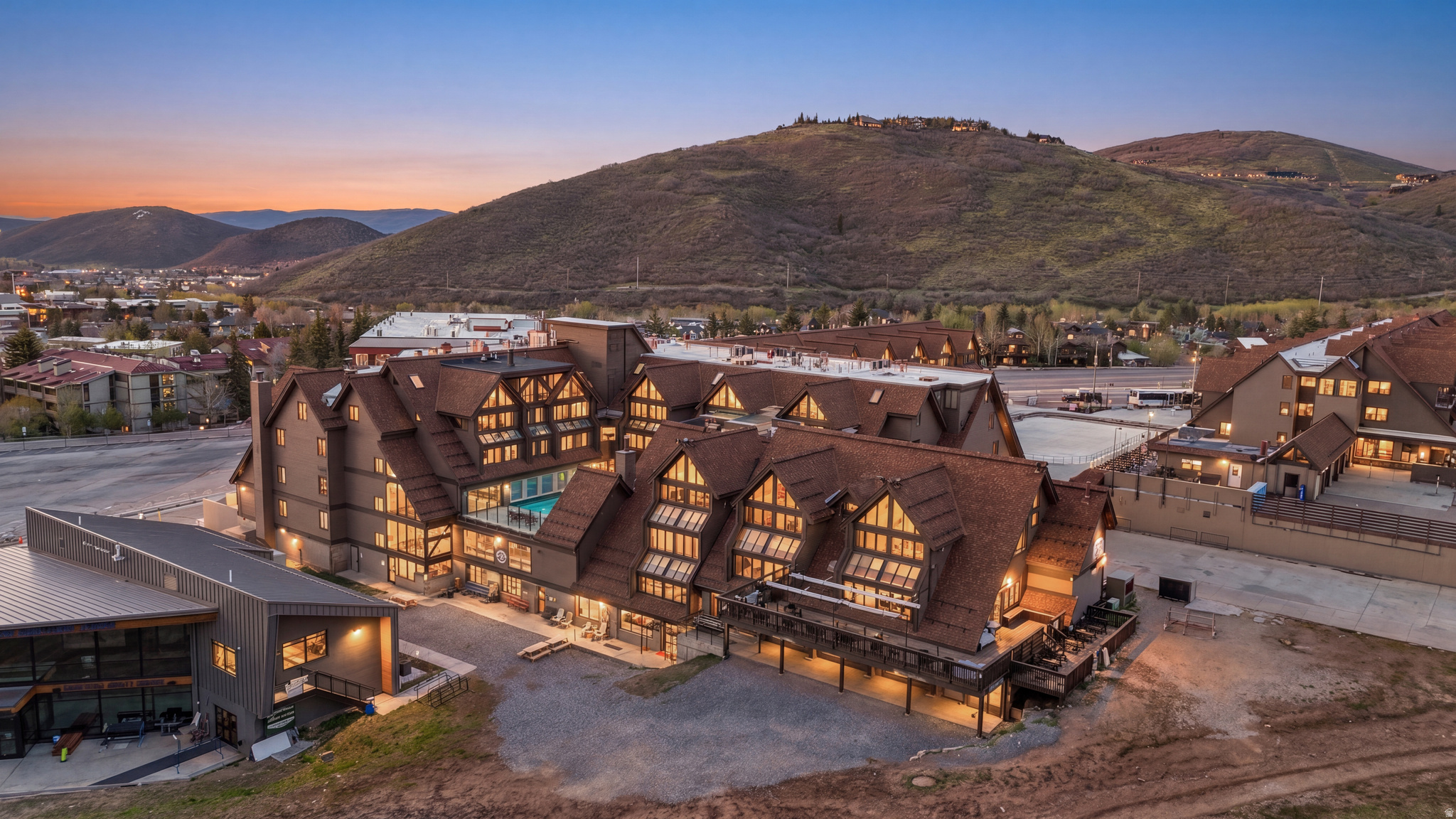 Located in the heart of Park City Mountain Village, this fully furnished and turn-key Resort Center condo offers an incredible opportunity to own at the base of Park City Mountain. With four bedrooms, three full bathrooms, one half bathroom and 1,482 square feet, the residence is thoughtfully designed for comfort, convenience and year-round enjoyment.  The inviting great room is filled with natural light and features mountain-inspired finishes, a cozy fireplace and comfortable gathering space after a day on the slopes. A dining area with expanded windows captures an amazing view, creating a beautiful setting for meals, entertaining and relaxing with guests. The main level includes one bedroom en-suite, along with a convenient half bathroom. The condo comfortably sleeps eight guests and includes forced air, A/C, fresh new paint and a stackable washer and dryer for added convenience.  Two hall storage units, if available, provide additional space for skis, snowboards, gear and personal items. Step outside and enjoy exceptional ski access, with the ability to ski out to First Time, 3 Kings or Eagle chair lifts and ski back in with a short walk to the unit. Resort Center places you directly among the energy of Park City Mountain Village, surrounded by restaurants, shopping, ski shops and gear rentals.  Owners and guests enjoy access to Resort Center amenities, including a gym, year-round heated pool and hot tub, along with one unassigned underground parking space. Ideally positioned near Old Town and just minutes from Main Street dining, shopping and entertainment, this property is equally appealing as a vacation home, second residence or investment property. Nightly and long-term rentals are allowed, with the option to use your own property manager.  From winter ice skating and world-class skiing to summer activities including the Mountain Coaster, Alpine Slide, ZipRider, mini golf, climbing wall and mountain biking, this condo offers four-season Park City living in one of the area's most desirable resort locations.