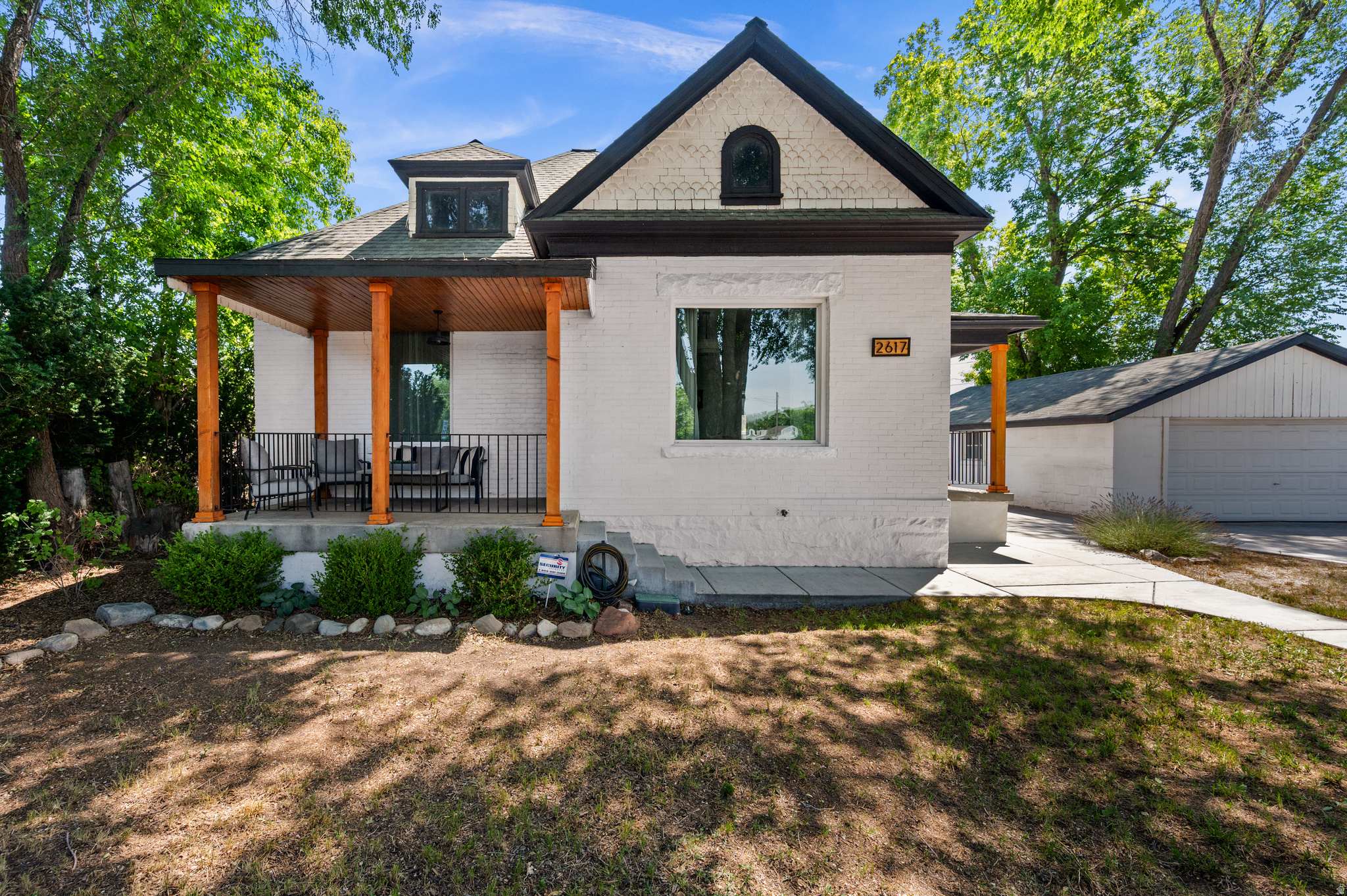 Welcome to 2617 S 300 E, a beautifully restored Victorian offering a rare opportunity to own a piece of Salt Lake City's history. Thoughtfully updated while preserving its timeless character, this move-in-ready home features 3 bedrooms, 2 full bathrooms, and an oversized two-car garage. Situated on a spacious lot, the property is a gardener's dream with mature trees, fruit trees, a vegetable garden, a chicken coop (bring your chickens!), and stunning mountain views from the backyard. Entertain with ease on the spacious Trex deck surrounded by perennial flowers, then gather around the firepit for drinks and dessert under the stars.The extra-length two-car garage with an automatic opener is ideal for hobbyists, woodworkers, or anyone needing exceptional workspace. Powered by the home's 200-amp electrical service, it offers plenty of capacity for tools, equipment, or electric vehicle charging. The extended driveway comfortably accommodates up to four additional vehicles.The home's exterior is every bit as impressive, showcasing meticulously maintained Victorian millwork, an updated color palette, and two inviting covered front porches with custom railings and wood columns: perfect for enjoying your morning coffee or watching the beloved South Salt Lake Fourth of July Parade as it passes right down the street. Inside the home you'll be stunned by the sweeping 10 foot ceilings throughout, as well as the original trim and refinished hardwood floors.  The inviting eat-in kitchen is designed for both everyday living and entertaining, featuring stainless steel appliances, double ovens, and a built-in gas cooktop. Just off the kitchen, the spacious mudroom includes the washer and dryer along with abundant built-in cabinetry for convenient storage.The primary suite offers a private retreat with an en-suite bathroom featuring a large soaking tub, separate shower, and private water closet. Two additional bedrooms provide plenty of space for guests, a home office, or flexible living. Ideally located with convenient access to downtown, major commuting routes, shopping, dining, and Utah's world-class outdoor recreation, this home combines historic charm with modern comfort. Don't miss the opportunity to make this lovingly restored Victorian your own.