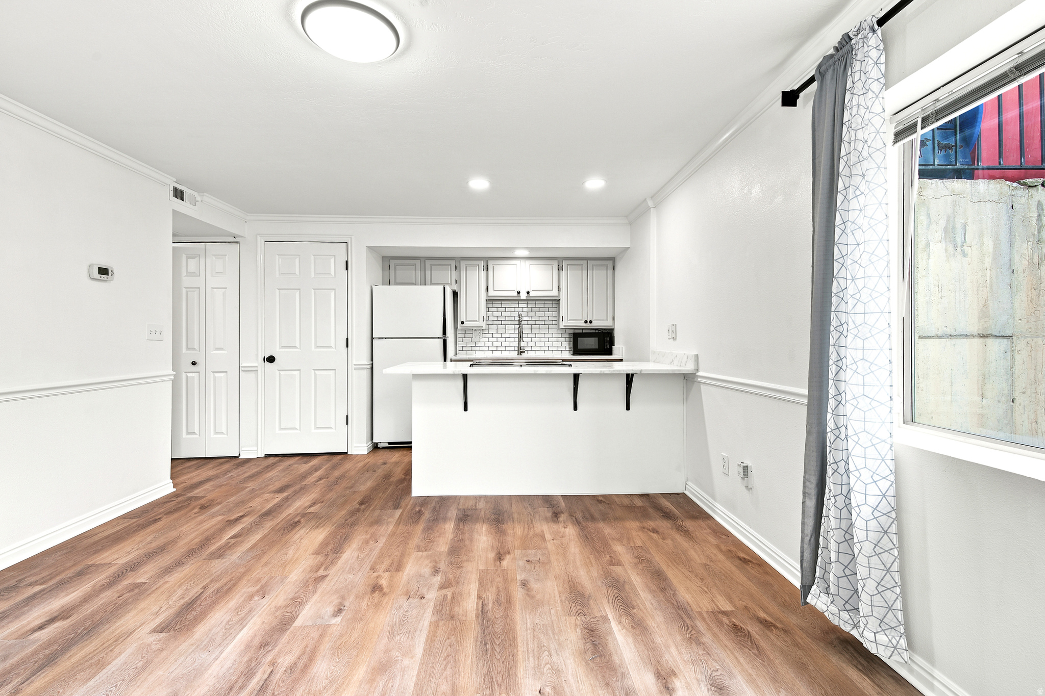 Don't miss this clean, well-maintained condo in a great Provo location! With quick access to I-15 and the FrontRunner station, getting around is easy while still enjoying a quiet, safe community. You'll also be close to parks, walking and biking trails, shopping, and other everyday conveniences. Inside, you'll find brand-new quality LVP flooring, newer carpet, and beautiful new countertops that give the home a fresh, updated feel. The refrigerator, range, microwave, washer, and dryer are all included, so it's ready for you to move right in. This home has been thoughtfully updated and is ready for its next owner. Come see everything it has to offer!   Square footage figures are provided as a courtesy estimate only and were obtained from county records. Buyer is advised to obtain an independent measurement.