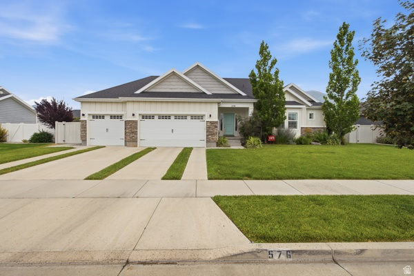 Beautiful rambler in the sought-after Legacy Farms neighborhood of Spanish Fork! This spacious home features 5 bedrooms, 3 bathrooms, an open-concept floor plan, a mostly finished basement, craft room/den,  exercise room, and a 3-car garage.  Enjoy quality finishes throughout, including quartz countertops, quarter-sawn oak cabinets, a large kitchen island, plantation shutters, updated lighting and fixtures, a gas range and abundant storage.  The fully fenced backyard is perfect for relaxing or entertaining with two custom pergolas, a gas fire pit, and a 6-person Bullfrog hot tub included. Conveniently located near shopping, I-15, parks, schools, and other amenities.