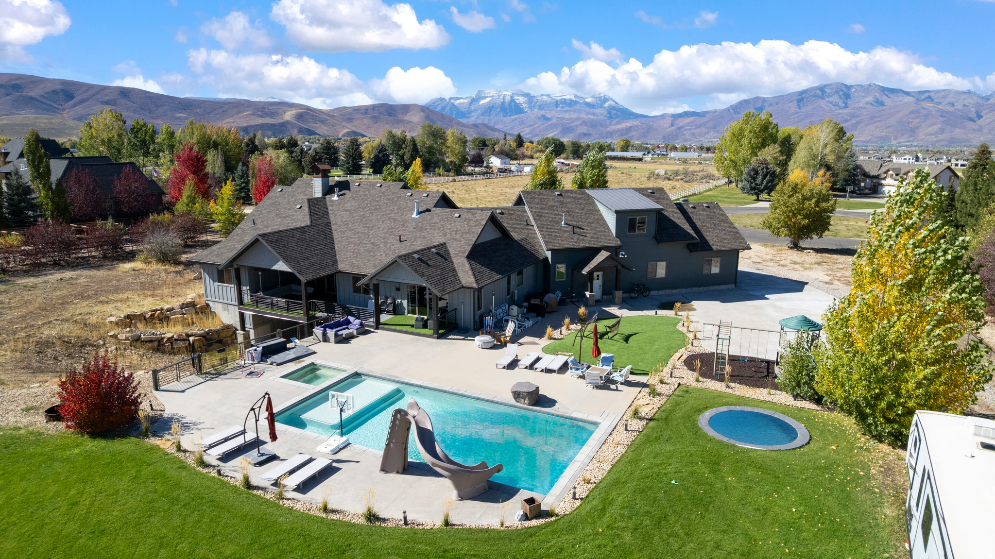 Custom built home in cul-de-sac that sits on 2.5 acres with swimming pool and hot tub. This custom home has incredible views of mountains and the valley and is located minutes from hiking, biking, skiing, shopping, and schools.  Complete with large open concept floor plan, amazing covered deck and patio, vaulted ceilings, double ovens, huge owners suite, steam shower, walk out basement, RV parking and oversized garage, and so much more.  Please schedule showing with Agent or through aligned showings.