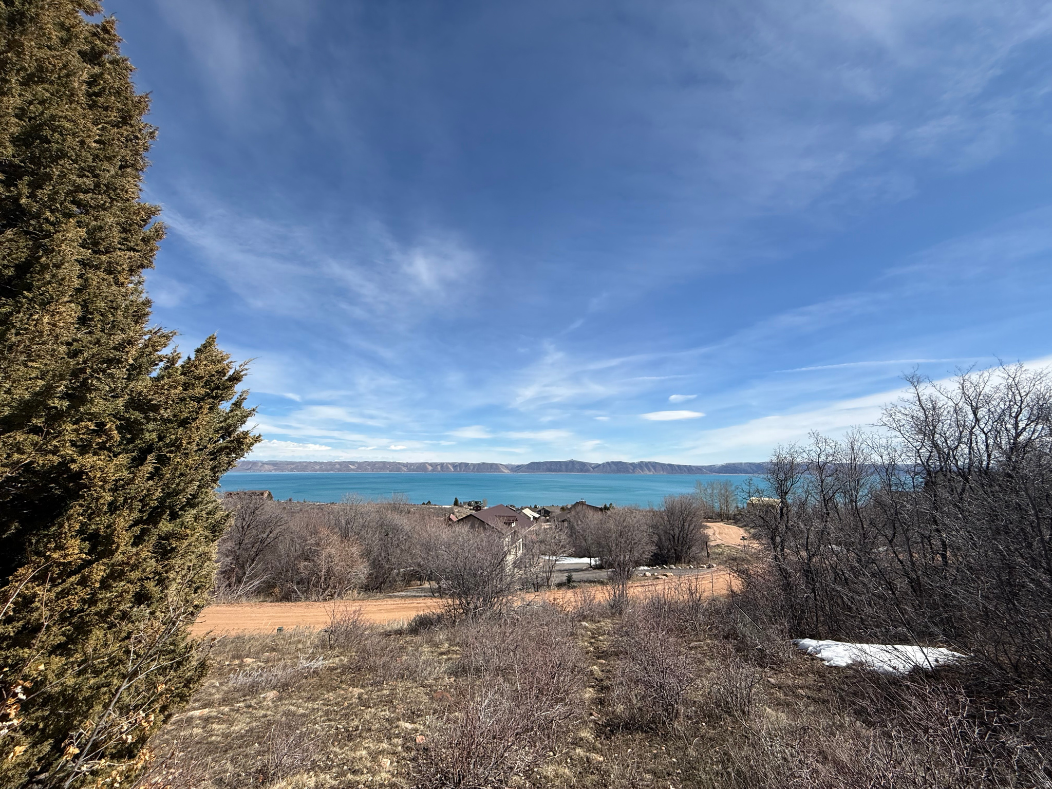 Beautiful Bear Lake West building lot with an unobstructed view of the lake! Mature trees and easy year round access. Bring your golf cart and drive right to the course from your garage! Amenities include road maintenance year round, 9-hole golf course, pickle ball courts, private beach access, and an in ground pool! Happy to recommend a list of local builders as well.