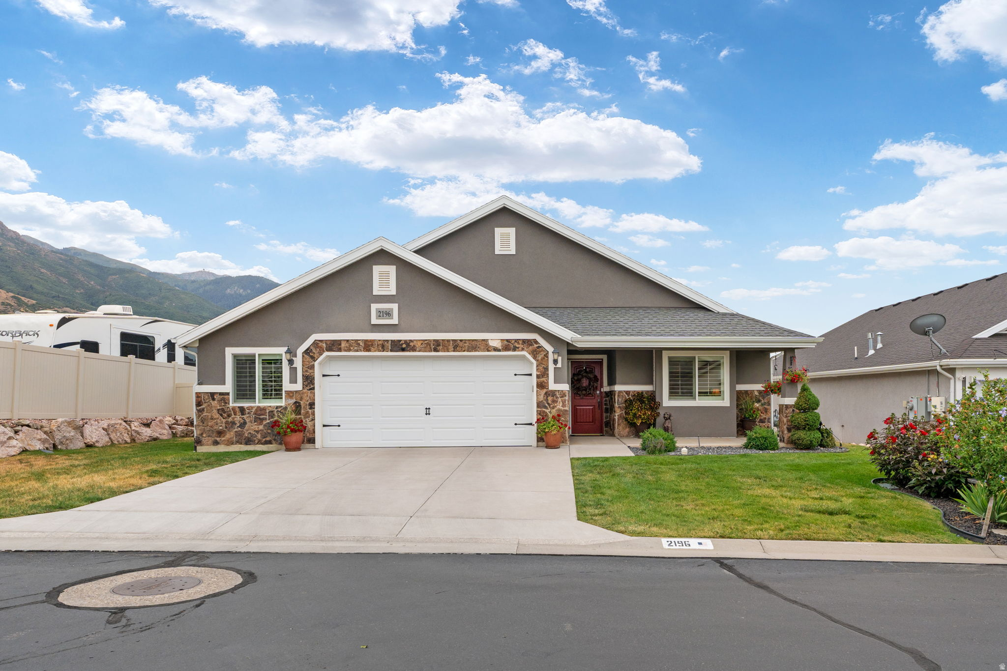 Located in East Layton, this highly sought-after patio home offers single-level living with no-step entry and a pride-of-ownership feel throughout. The home features 2 bedrooms, a versatile office that could be converted to a third bedroom, and 2.5 bathrooms, with wider hallways and doorways designed to accommodate wheelchair access. The second bedroom includes a full bathroom with a walk-in, wheelchair-accessible tub, and the extra-wide garage provides generous storage. Additional highlights include a tankless water heater, brand-new A/C, a roof replaced within the last five years, and beautiful shutters throughout. For peace of mind, there's a generator to power the house. The fully fenced backyard showcases a large covered patio, a serene water feature, and a secluded feel. Conveniently, the home is near Valley View Golf Course and offers easy access to Highway 89 and Layton's amenities. Be sure to check out the home's video tour.