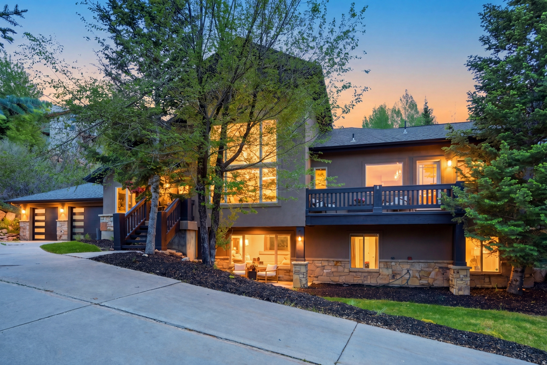 This home has STAR power. The kind of place you walk into "just to see" and suddenly start mentally deciding which closet will be yours. Completely reimagined and meticulously upgraded, every inch of this home has been elevated by one of Park City's most sought-after designers. Thoughtful and effortlessly cool, the spaces feel both magazine-worthy and genuinely livable. In fact, the kitchen quite literally had its moment in the spotlight -- featured in a top publication for its standout design and unforgettable style. And speaking of the kitchen... if you love to cook, gather, snack, host, linger, or pretend you're on a cooking show while making coffee, this one delivers. Designed by someone who actually lives the chef life, it features a stunning 72" Viking refrigerator, gas range, oversized restaurant sink, and one of the most functional and imaginative layouts ever. The tiered backyard has one level dedicated to grown-up serenity: shaded seating areas, a cozy outdoor reading nook, a hot tub, and the kind of ambiance that practically requires a glass of wine at sunset. Just above, a spacious grassy play yard is ready for kids, dogs, cartwheels, fetch, or all of the above. The main level features a dreamy primary suite with a private deck, an additional bedroom or office, an expansive great room, and a music room that could easily become your next creative escape or office. Downstairs, the walkout lower level continues to impress with three additional bedrooms, another office or play space, a huge flex/fitness room, and a warm, inviting family room with fireplace and direct outdoor access. This isn't just a beautiful home -- it's a home people don't want to leave. Rich textures, soulful colors, and a calming palette create a feeling that's equal parts luxury retreat and everyday sanctuary.
