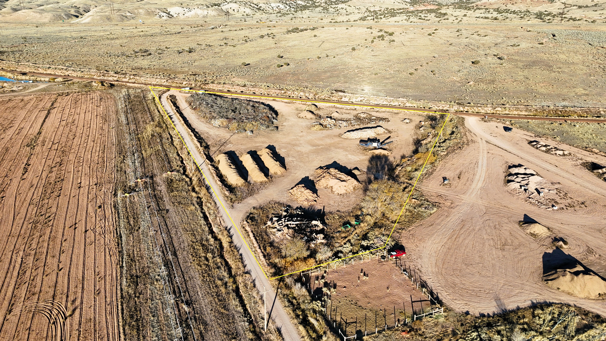 Compost, Green Recycling & Soil Amendment Business on 6 Acres This rare commercial offering provides an established compost, green-recycling, and soil-amendment business positioned for substantial growth. Situated on approximately 6 acres, the property includes a small portable office, a large operational yard, power, and extensive compost and soil-related inventory. For a new owner-operator, this could be an opportunity to take the building blocks in place and create a business with strong market demand. This site offers proven production capacity and scalable potential. Substantial wood-compost inventory ready for processing and distribution. Soil Resources & Lease Opportunities Adjacent acreage, available for lease, provides access to native iron-rich sandy loam soil known as "Ferrozite." Lab testing from Stukenholtz Laboratories indicates high levels of iron and essential nutrients including N, P, K, S, Z, and M. This soil has been used as a slow-release micronutrient source that supports plant vigor, chlorophyll production, and enzyme and nitrogen-fixation functions. Operational Strengths The business focuses on producing high-quality soil and wood compost, recommended for: Raised beds Lawn topsoil blends Gardens and flower beds Agricultural soil amendment Commercial or residential landscape supply production The demand for soil-health products continues to rise alongside the growth of gardening, hobby farming, and regenerative agriculture across Utah. This operation is well-positioned to supply this expanding market. Infrastructure & Expansion Potential Power on site with ample yard space Room for a bagging operation, enabling broader product distribution Nearby access to major interstate corridors (I-70 & I-15) Space to increase green recycling capacity Ability to scale both wholesale and retail supply chains Summary All foundational components of a profitable soil-products business are already in place--inventory, soil access, workforce layout, utilities, and transportation connections. This is an excellent opportunity for a buyer looking to take over a functioning operation and expand it to match growing market demand. Contact the listing agent for pricing, equipment lists, operational details, or to schedule a property tour.