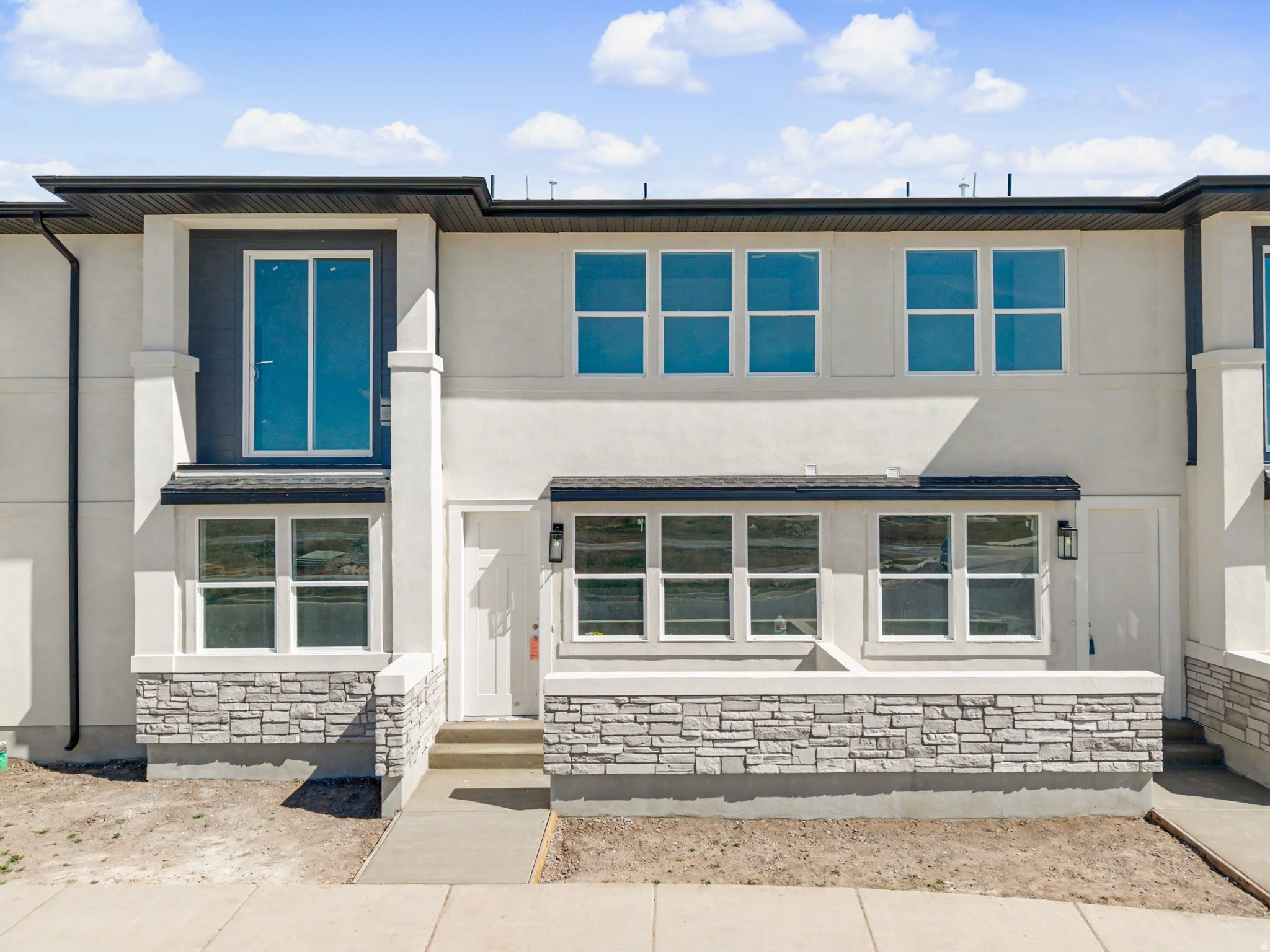 This 4-bedroom, 2.5-bath mid-row townhome delivers more than expected, featuring a true laundry room, walk-in pantry, private balconies, and open living spaces with modern finishes. Every detail, including the 2-car garage, was designed for comfort and convenience. Location is everything: set in a prime Springville neighborhood, you are just 1 minute from schools and parks, 2 minutes from Smith's Marketplace, and 3 minutes from I-15. Use our preferred lender to take advantage of $5,000 in available incentives to buy down the rate, or reduce the monthly payment and help make this dream home yours!  First-time buyers may also qualify for up to 10% or $40,000 in down payment assistance (DPA) to lower upfront and closing costs. This Unit 743 recently appraising for $475K, this home offers incredible value. Buyer to verify all information.