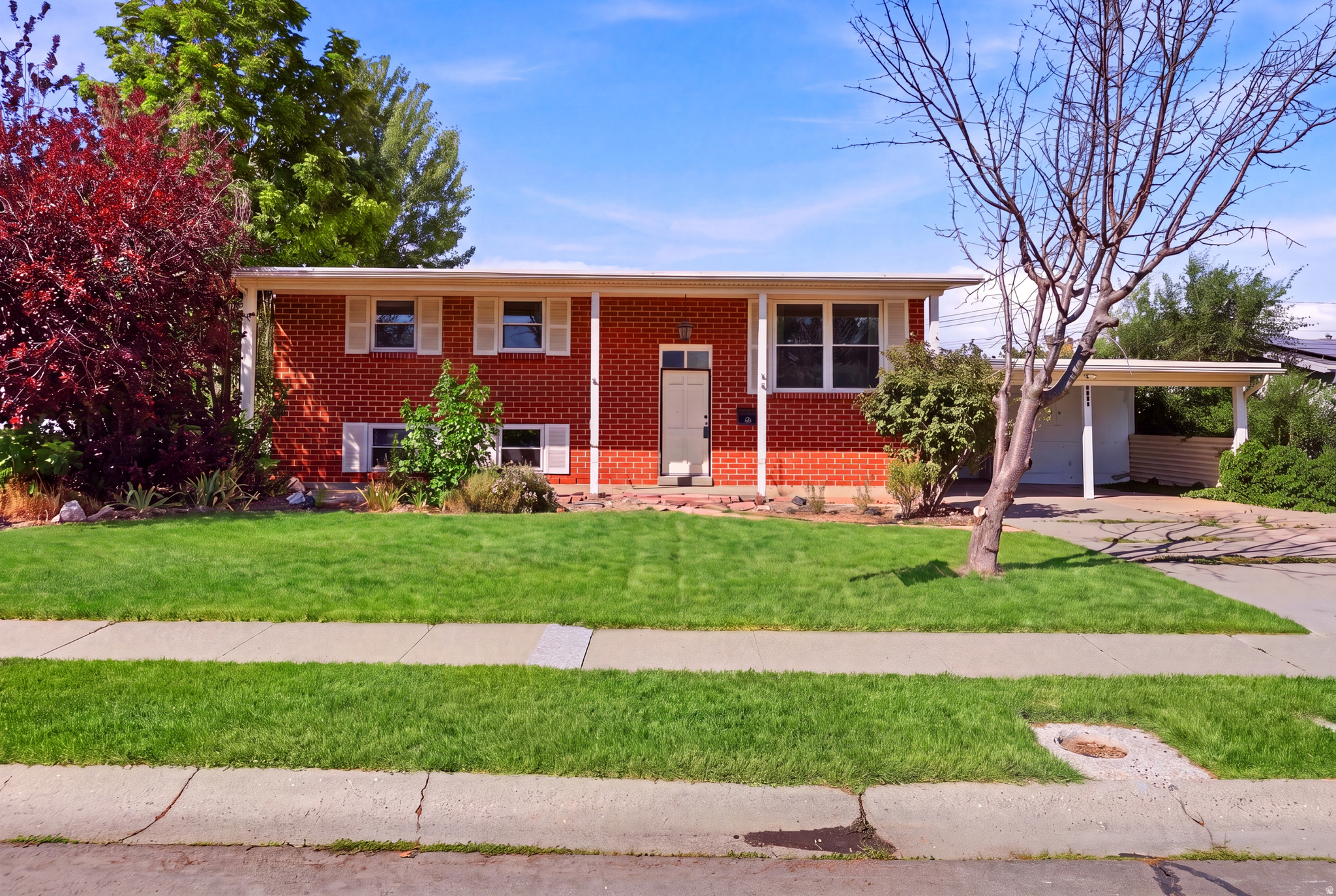 Welcome to this beautiful well-maintained home in the heart of Taylorsville! This property sits on just under a quarter acre and just recently got a new sprinkler system installed (all coming back to life!) The home has 2 kitchens and 6 bedrooms! Could be used as a mother-in-law or even a rental with the separate entrance leading right out to the carport.   Square footage figures are provided as a courtesy estimate only and were obtained from the previous MLS .  Buyer is advised to obtain an independent measurement. Pictures are edited to show the grass lively and green but is still being brought back to life FYI