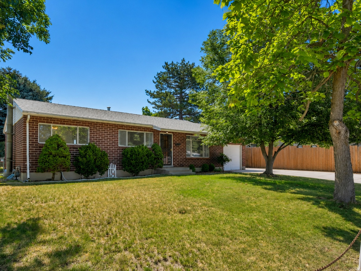 Beautifully updated all-brick rambler in desirable Cottonwood Heights! This move-in ready home features a new furnace & A/C, water heater,  fresh paint, carpet, & brand new appliances. Mature trees, a private backyard, large garden space & covered patio create the perfect setting for relaxing or entertaining. The heated workshop with an air compressor & loft storage is a dream for hobbyists or anyone needing extra workspace. Quiet neighborhood just minutes from world-class skiing, shopping, dining, parks, schools, and freeway access!