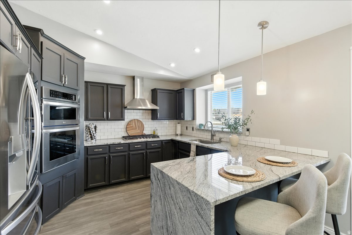A basement entrance AND a separate detached ADU studio in this 5 bedroom, 4 bath home, nestled into a quiet neighborhood, minutes from downtown Salt Lake City, with all of the extras. No backyard neighbors, remodeled kitchen with a waterfall quartz countertops, oversized dining area, and an included built-in sauna. There is a detached temperature controlled shop with it's own bathroom (for hobbies, business or even could be converted into a studio rental). In addition, find EV hookups, a full outdoor covered kitchen with multiple grilling spaces and a refrigerator to make entertaining a breeze. Find a primary bedroom with ensuite bathroom and two secondary bedrooms with a full hall bathroom on the 2nd floor. The basement, with a separate entrance, leads into two additional bedrooms and a bathroom. Seller is willing to add a kitchen to the basement with full price offer. Square footage figures are provided as a courtesy estimate only and were obtained from an appraiser. Buyer is advised to obtain an independent measurement.