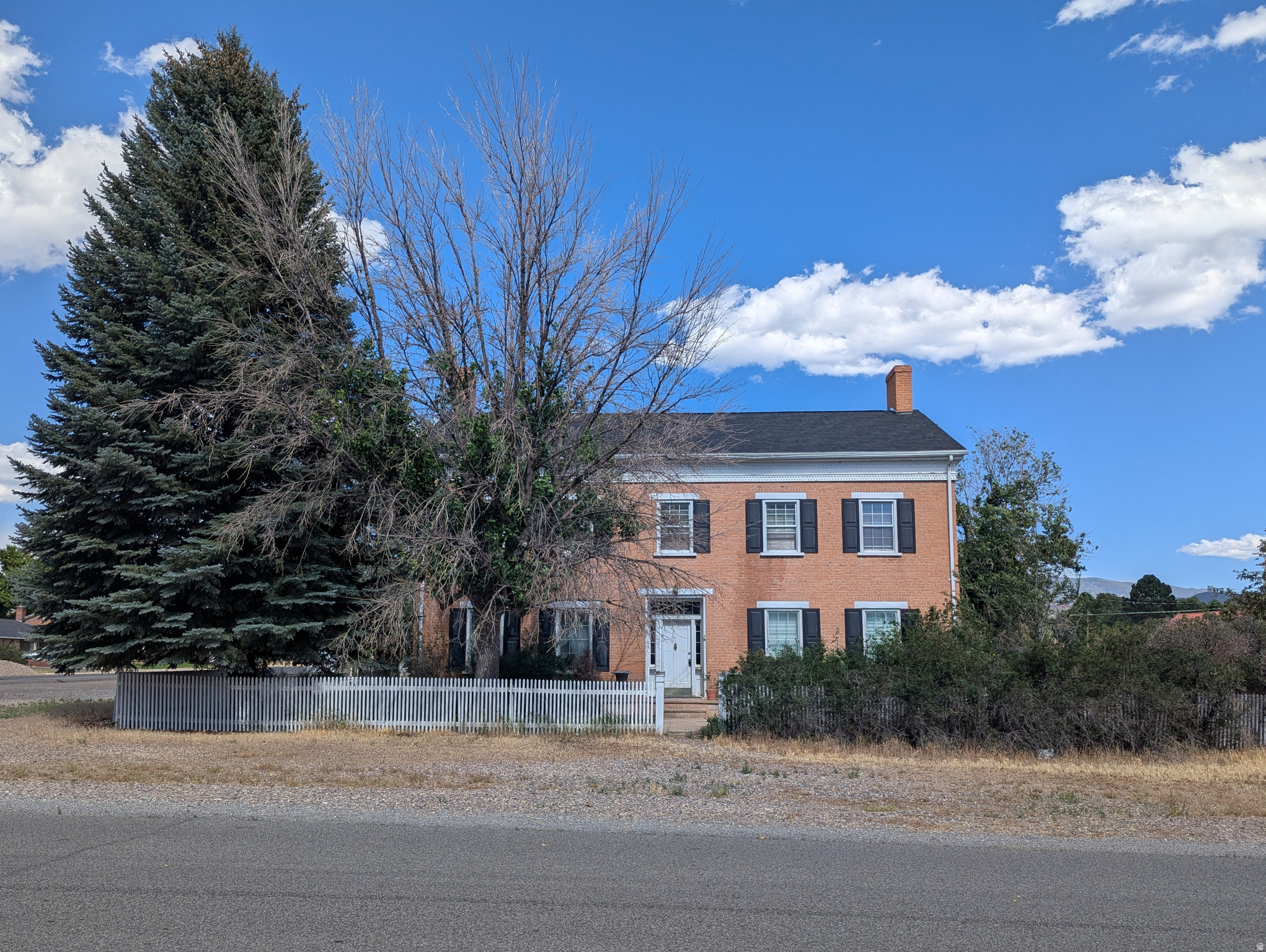 Imagine a stately red brick Manor built in 1876, recognized by the historical society now hitting the market for the first time in 50 years. The love and laughter of family filled the walls for decades. Venture outdoors to the spacious lawn, patio and open 4-car covered parking. Get caught up in the charm, ease, and flow on the main floor. Watch how high ceilings create the possibility of an additional 1500 square feet of living space. This home is an as-is must-see with endless possibilities.