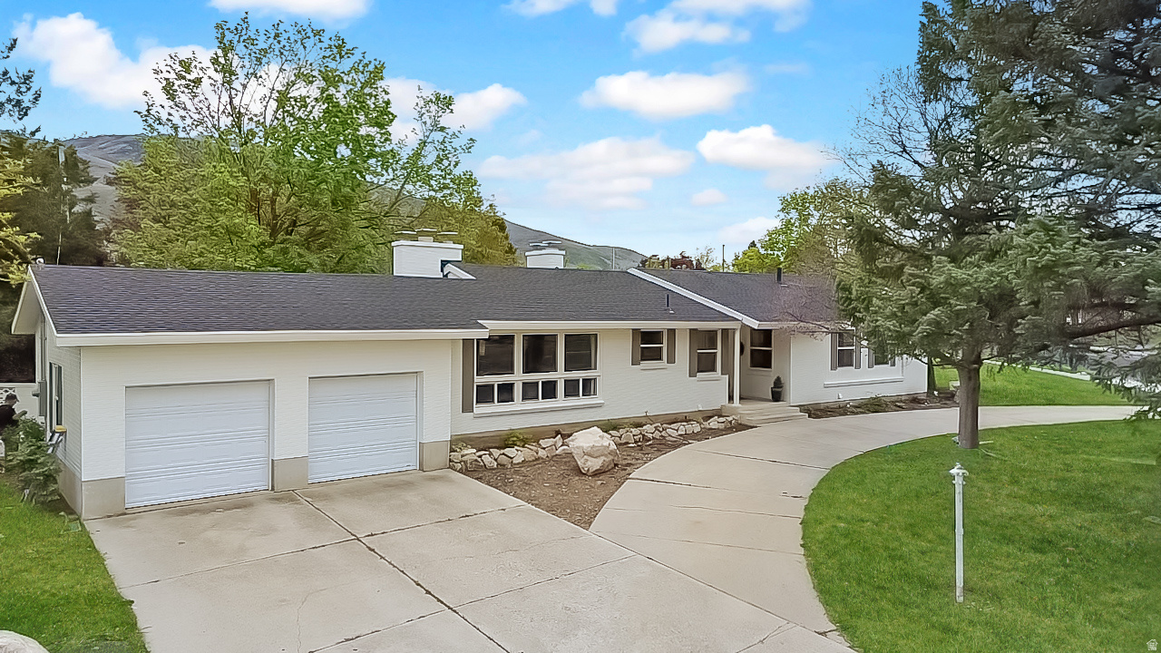 If you've been dreaming of a home with personality, light, and space this is it. Located on Brigham City's east side, this 5-bedroom, 3-bathroom home sits on a large corner lot and immediately draws you in with its freshly painted white exterior and incredible curb appeal. Inside, you'll find a rich, moody ambiance paired with an open, flowing layout and brand-new windows that flood the home with natural light. Thoughtful updates throughout include new garage doors, a brand-new roof installed just last week, and an HVAC system that's only 3 years old. It's the perfect balance of cozy and elevated.