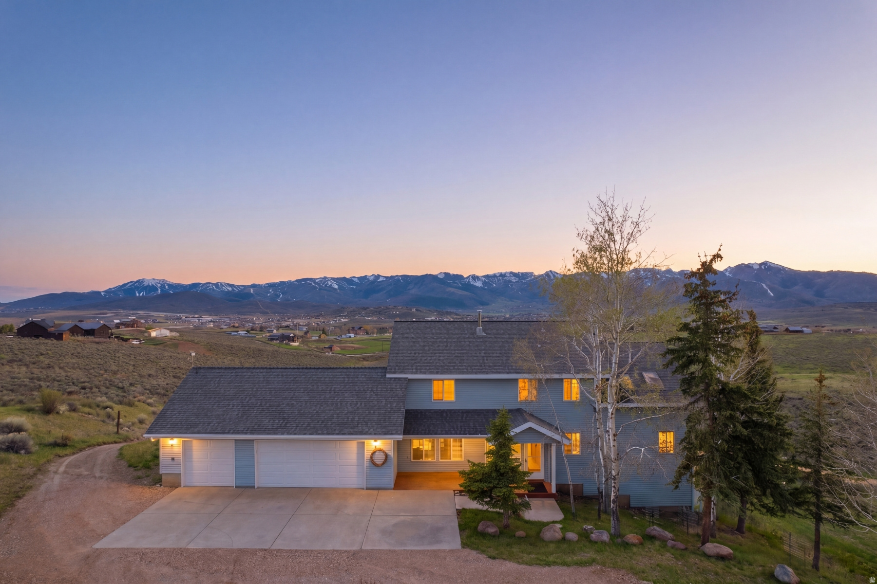 Perched on over 9 pristine acres in Silver Creek Estates, this property delivers the kind of views that simply can't be described -- only experienced. Sweeping, unobstructed panoramas stretch across the valley to the ski mountains, with no rooftops or freeway in sight -- just open sky and endless horizon. Thoughtfully positioned to maximize every angle, the 3-bedroom, 2-bath residence offers effortless main-level living. The heart of the home, a spacious kitchen and great room, frames breathtaking, tip-to-tail Olympic Park to Deer Valley East mountain views, while the private primary suite provides a serene retreat on the same, main floor. With a 3-car attached garage and an additional RV garage below featuring a 10' door, there's room for all your vehicles, gear, and ambitions. Whether you envision horses grazing at sunrise, a thriving garden, or simply space to breathe, this "farm fresh" estate is more than a home -- it's a rare opportunity to create your own legacy. Bring your animals, your imagination, and your dreams -- this is a canvas unlike any other.