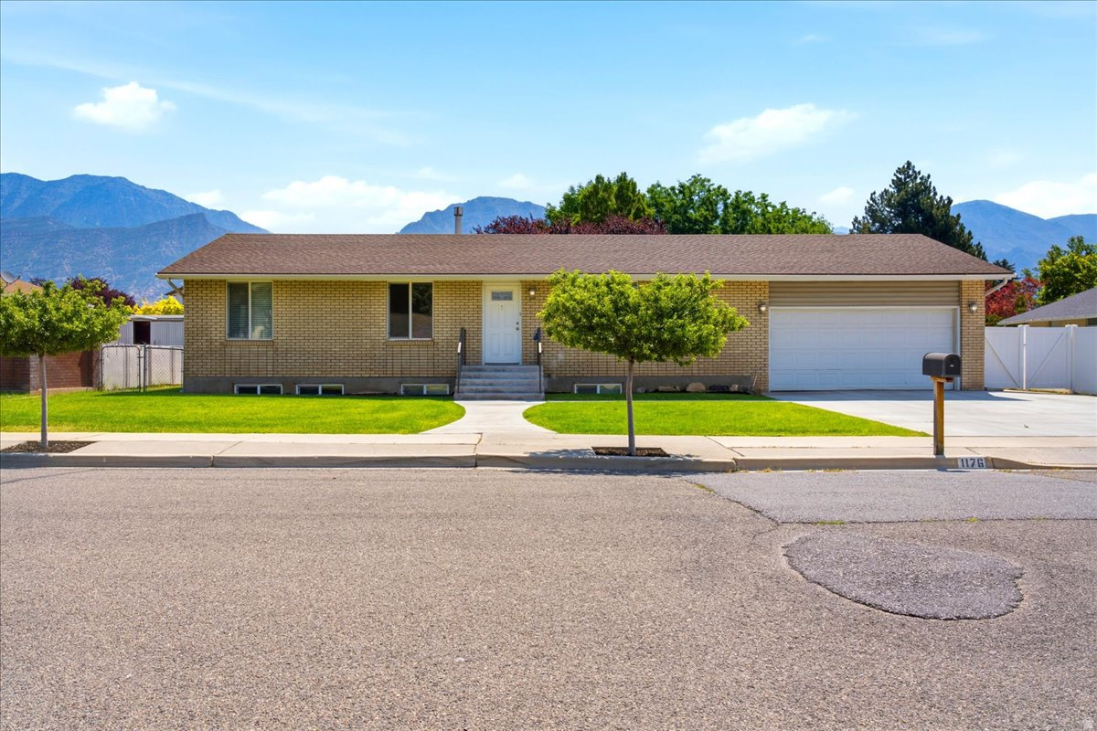 Some homes are simply houses. Others become part of a family's story.  For the past 27 years, this beloved Grandview brick rambler has been exactly that - a place filled with memories, care, and pride of ownership. Nestled in one of Provo's most sought-after neighborhoods, this 4-bedroom, 3-bath home offers timeless appeal and thoughtfully designed spaces throughout.  A striking office just off the front entry, framed by beautiful wood and glass french doors, sets a warm and welcoming tone the moment you walk in. The expanded kitchen is a standout - offering more room to gather, cook, and connect than you'd typically find in homes of this style and era.  Step outside to a meticulously maintained yard featuring three raised garden beds, ideal for anyone who loves spending time outdoors. The large driveway offers plenty of room for parking, with space to spare for all the toys -  additional vehicles, trailers, RV parking or whatever adventure brings home.  And with BYU, UVU, parks, dining, and everything Provo has to offer just minutes away, this is the kind of neighborhood people move into and never want to leave.  After 27 years of loving this home, the owners are ready to pass it on to its next chapter - and the next family to fill it with stories of their own.  Square footage figures are provided as a courtesy estimate only.  Buyer is advised to obtain an independent measurement.  Buyer and Buyer's agent to verify all information.  Agent is related to Seller.