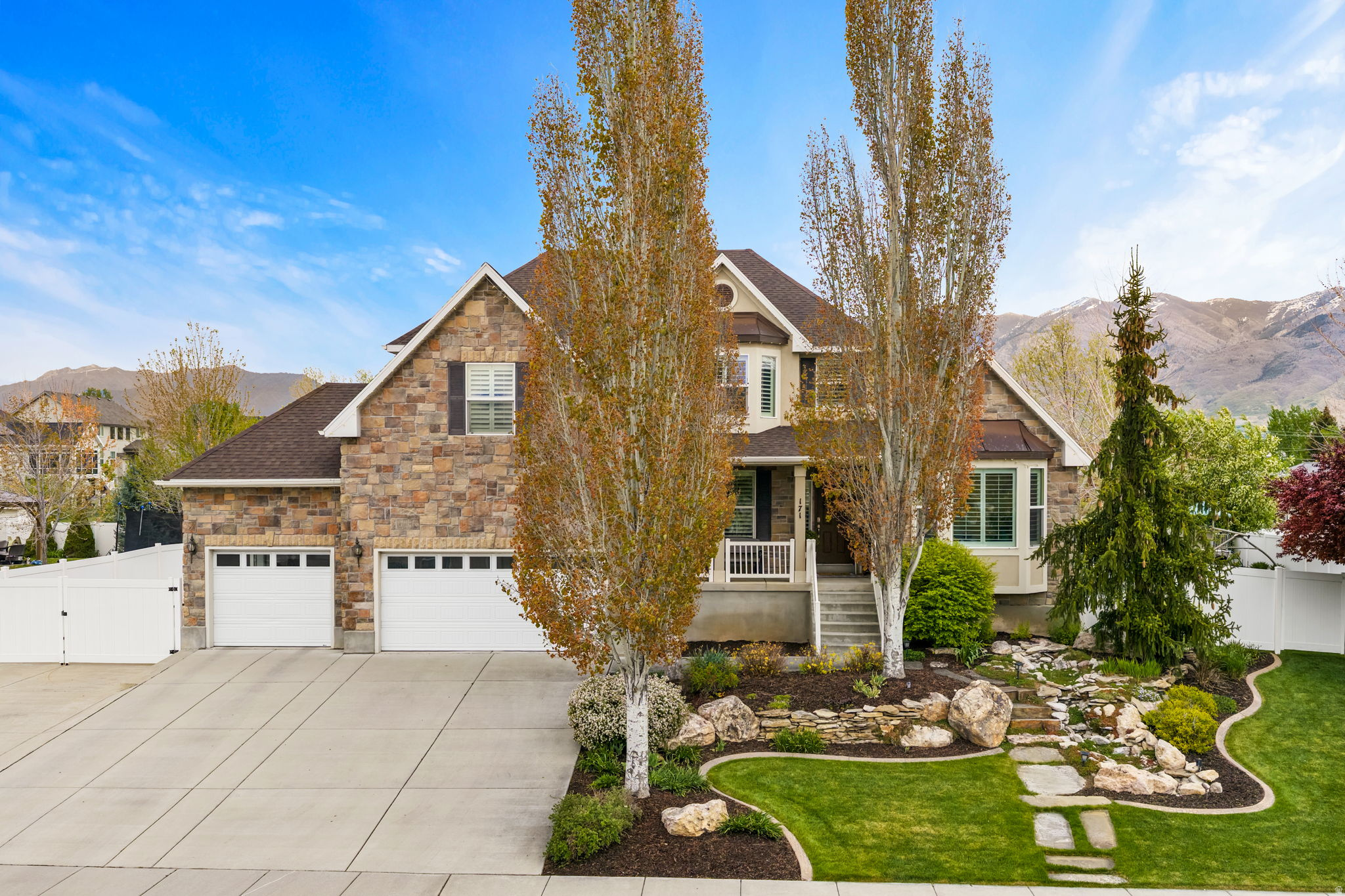 Welcome to a home that truly has it all and sits in a great location (close to the new Legacy Parkway). This meticulously maintained home offers a blend of spacious indoor living and a private outdoor entertainment space. With 7 bedrooms, a bonus room, a theater room, and the option for a mother-in-law rental in the basement - you won't want to miss out on this one! The kitchen includes a pantry and double oven as well as a spot for your dining table. Enjoy the convenience and ease of a central vacuum system. The basement is designed with the option for a mother-in-law rental unit, providing a private living space, kitchen area, and separate entrance. Enjoy the sunrises from the beautiful covered deck outside your kitchen each morning. The backyard is curated for entertainment with a heated pool with electronic cover, in-ground trampoline, and an additional workshop/garage that has an outdoor bathroom attached to it making it convenient for the pool parties! Don't forget the outdoor landscape feature lighting. Schedule your private showing today!  Square footage figures are provided as a courtesy estimate only.  Buyer is advised to obtain an independent measurement.
