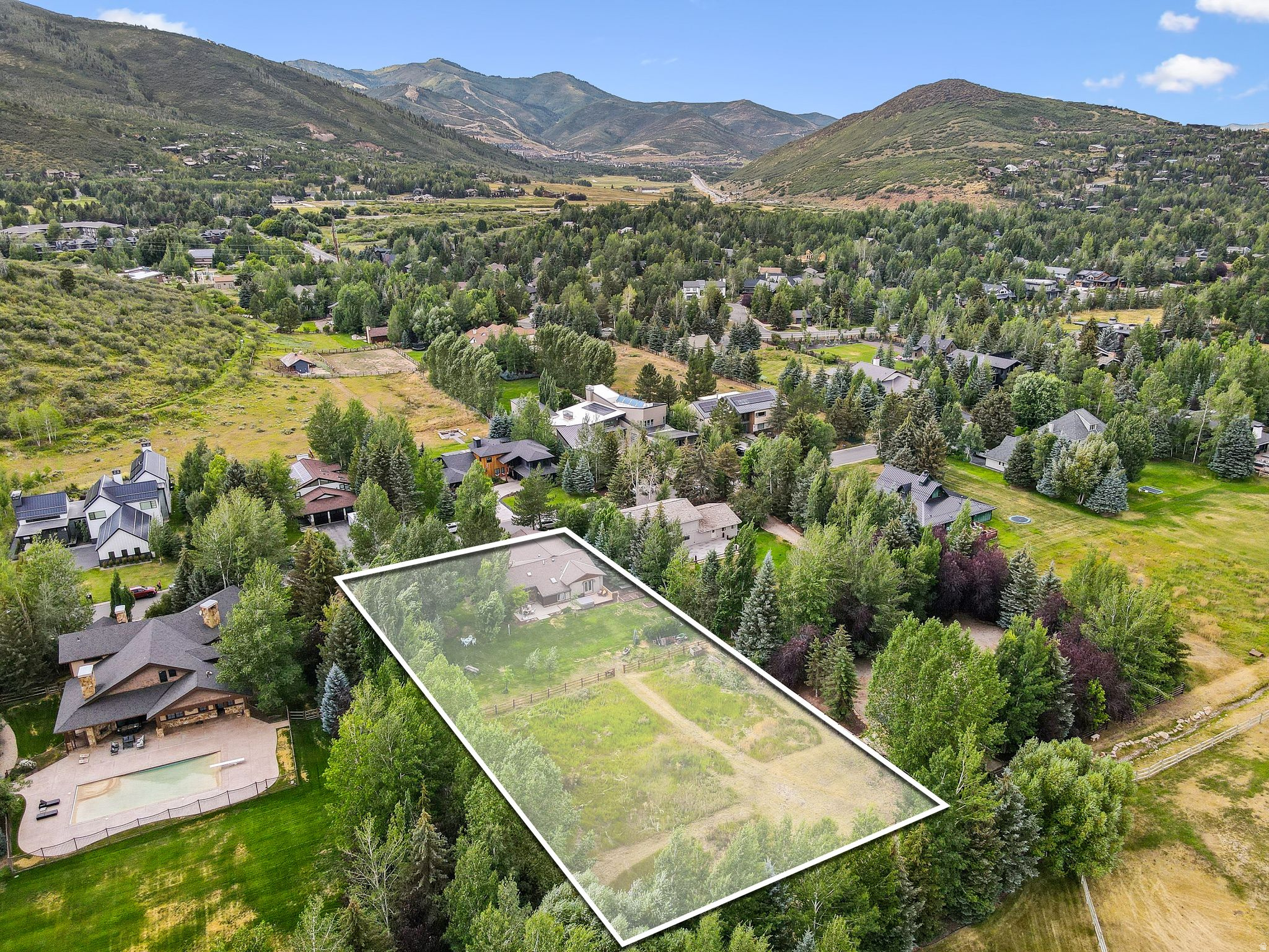 Located in the coveted Park Meadows Holiday Ranchettes, this rare 1+ acre property captures the very best of in-town living! The existing home sits on an expansive, flat lot surrounded by mature landscaping and open mountain views, creating the perfect foundation for your future dream estate. Whether you're looking to reimagine, rebuild, or simply enjoy as-is, the possibilities are truly limitless. One of the few neighborhoods in Park City that allows horses, Holiday Ranchettes combines a peaceful, country feel with unbeatable convenience - just minutes to schools, trails, golf, skiing, and Main Street. Within the Park City School District and surrounded by custom homes, this property offers a rare opportunity to own prime acreage in one of Park City's most desirable and enduring neighborhoods. Opportunities like this are few and far between - act now to secure your place in Park Meadows Holiday Ranchettes!