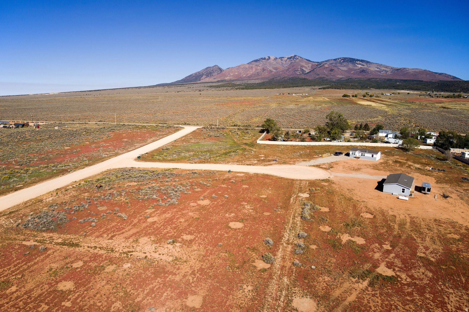 Peaceful small-town living awaits in Legacy Fields subdivision, located in the heart of La Sal just 30 minutes from Moab. Enjoy easy access to fishing, hiking, hunting, camping, and endless outdoor recreation in the beautiful La Sal Mountains. This is an excellent opportunity to build in a quiet and scenic setting. The purchase price includes a one-quarter interest in a shared well, with septic installation required. Fiber internet is available, adding modern convenience to this tranquil location. Protective covenants are in place to help preserve the long-term value of your investment. Seller reserves a utility easement across the south 15 feet of Lot 6 for the benefit of Lot 5.