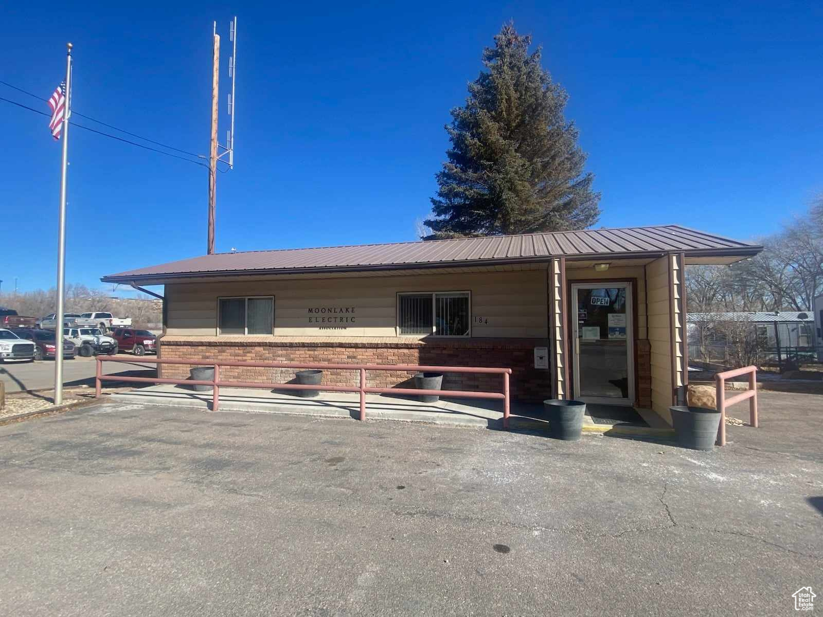 The Duchesne Moon Lake Electric Office at 184 North Center Street! Frontage on State Road 87!  Clean and ready for your Business!  The Main part of the office is all set up with a customer counter and room for all your technology! There is another office room on the north end of the building.  And a nice restroom.  The building is connected to all public utilities. The office sits on one of the best corner lots in the area and has plenty  of gravel parking in the rear and paved parking out front! Also qualifies for nightly or monthly rental!  Easy access day or night! Come take a look!  We have a potential buyer looking to rent to a business.  Let us know if we can work something out for your business!  It is a good buy!  It would be tough to find a home at this price!