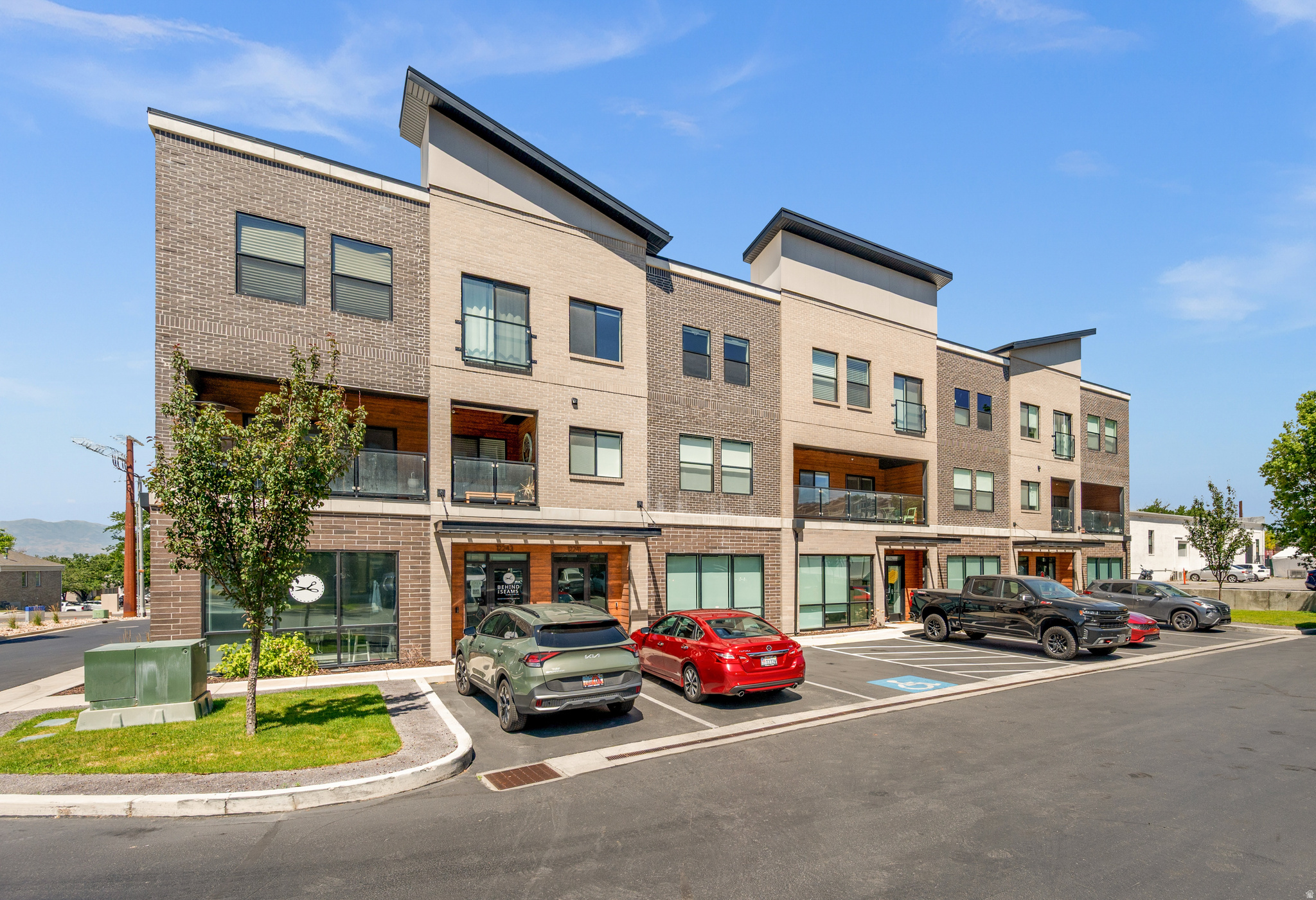Tucked inside an exclusive Draper development, this stunning live/work townhome is one of the most thoughtfully designed residences at its price point. High ceilings and premium finishes set the tone throughout, while custom built-ins, designer lighting, and motorized window shades on every window speak to a level of craftsmanship that really stands out. The kitchen opens to a covered patio perfect for morning coffee or an evening wind-down, and the 2-car attached garage adds everyday convenience. Three spacious bedrooms and a tankless water heater round out a home that's as functional as it is beautiful. The ground floor offers something most homes can't: a fully finished, 668 sq ft suite with ADA-compliant bathroom, glass storefront windows, perfectly suited as a home studio, creative space, or guest suite. OR let it work for you: rent it out for additional monthly income, or run your own boutique, salon, therapy practice, or office right from home. Whatever you envision, the flexibility is yours.