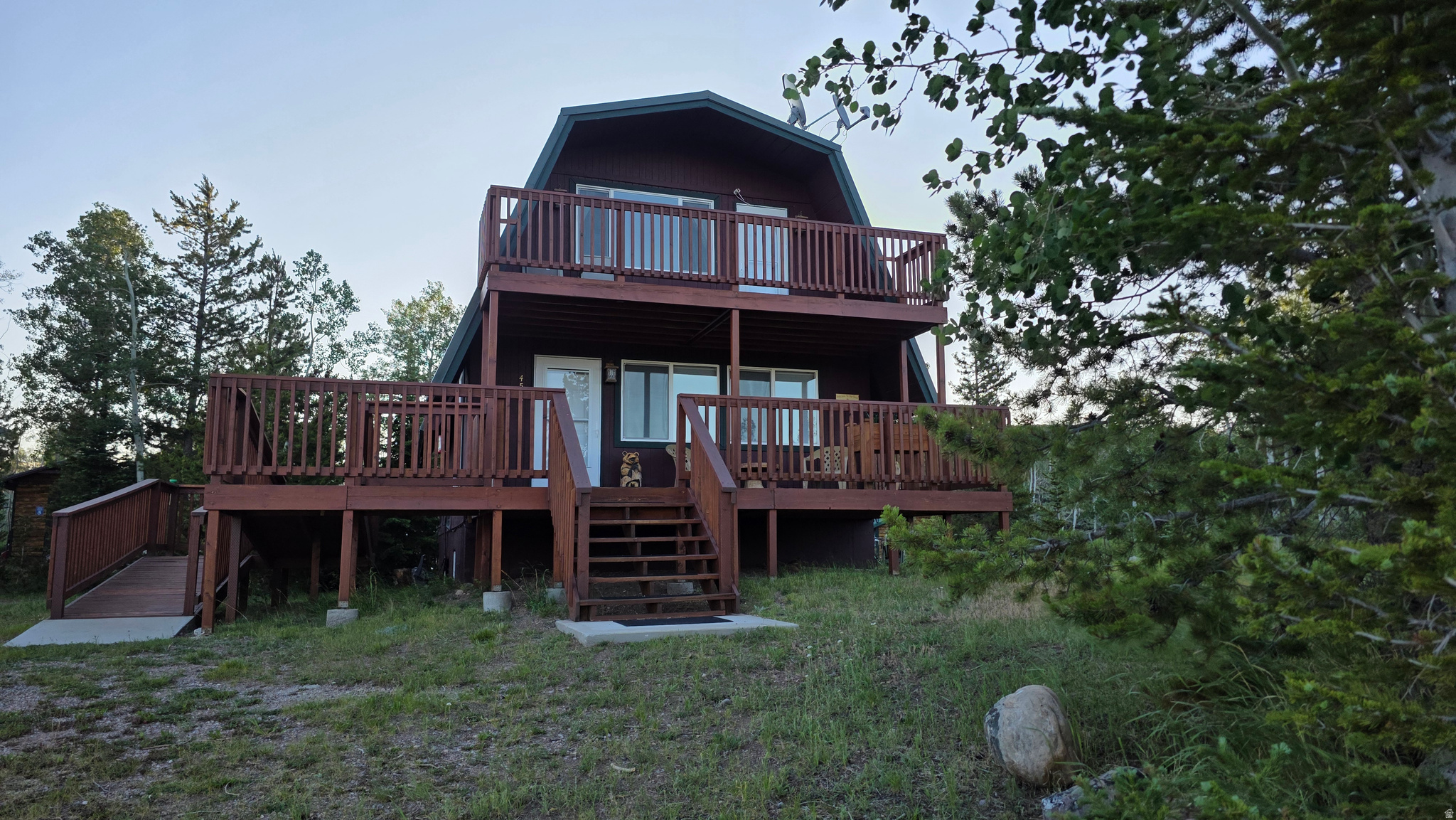 Going to the cabin will feel like coming home. You can't help but notice the love and care that has gone into this cabin. Located near the Christmas Meadows area of the Uinta Mountains, this cabin is impressive from front to back and top to bottom. From the deck view, the balcony view, the bedroom view, the finishings, the layout, the landscaped and manicured back yard and firepit area, to the playhouse and outbuildings. The cherry on top that makes this a slice of mountain heaven is the year-round access. The road is plowed to the driveway in the winter. This cabin is an incredible opportunity to own in the rarely available and close- knit Wilderness Acres Community, and to be just a stone's throw from the National Forest. Don't wait to schedule a showing, this one won't last long. Square Footage is a courtesy estimate, buyer is encouraged to get their own measurements.