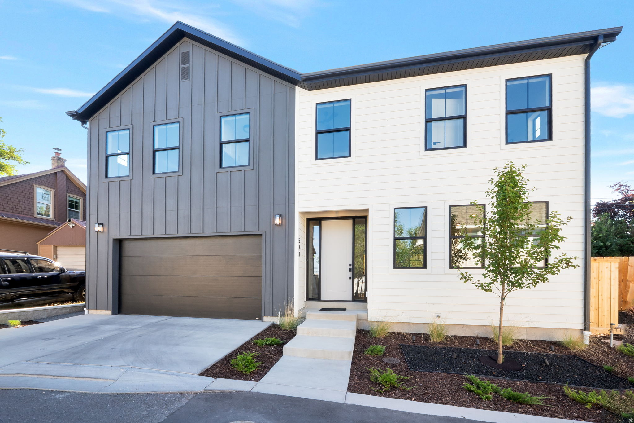 Discover this beautiful new construction home nestled on a quiet cul-de-sac, centrally located near the University of Utah and the lively 9th and 9th neighborhood, offering easy access education, eclectic dining, boutique shopping, and cultural hotspots. Step inside to an open-concept design that seamlessly blends modern elegance and functionality. The gourmet kitchen boasts sleek quartz countertops, high-end LG Studio appliances, ample cabinetry for storage, and a spacious island ideal for casual meals or entertaining guests. Adjacent, the inviting living room centers around a cozy gas fireplace, creating a warm focal point for family gatherings or quiet evenings. Upstairs, you'll find four generously sized bedrooms, highlighted by a luxurious primary suite featuring a walk-in closet for all your wardrobe needs and an expansive en-suite bathroom with heated tile floors, dual vanities, a soaking tub, and a separate glass-enclosed shower for ultimate relaxation. Outside, the low-maintenance yard is designed for effortless enjoyment, complete with a beautifully paved patio perfect for al fresco dining, barbecues, or simply unwinding under the stars. This move-in-ready gem combines contemporary style, premium finishes, and a prime location-don't miss your chance to call it home! Square footage figures are provided as a courtesy estimate, buyer is advised to obtain an independent measurement.