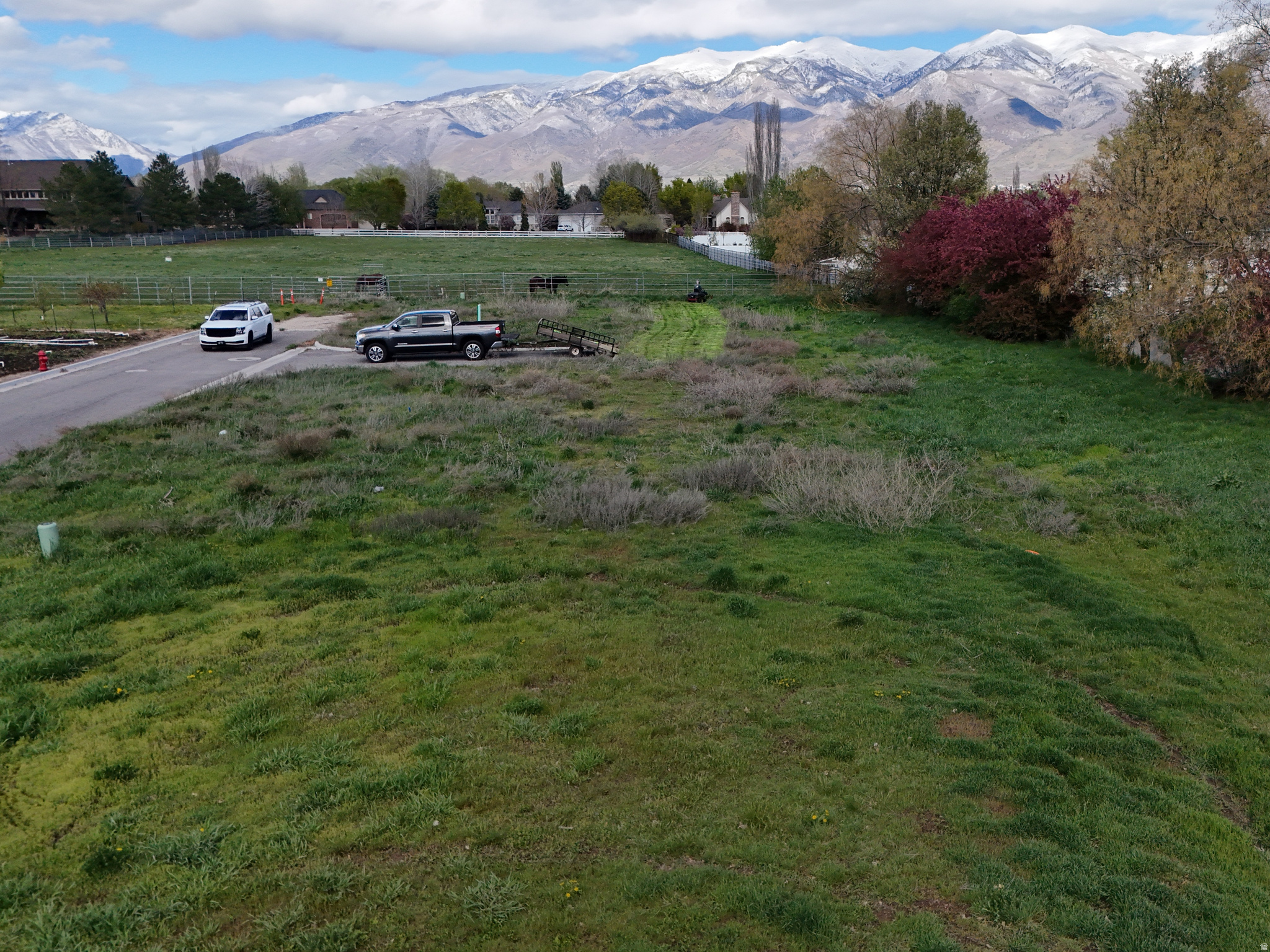 Rare immediately buildable Kaysville lot for sale to the public. Build your own or bring your builder. Buildable plans all ready to so available. Last lot on a dead-end private lane. Mature established shade trees line the Porperty line. All utilities available/stibbed (gas, electric, water, secondary and fiber.)  Just across the street and north of Angel Street Soccer Park. Only HOA expense is a reserve fund for ongoing maintenance of the private lane.