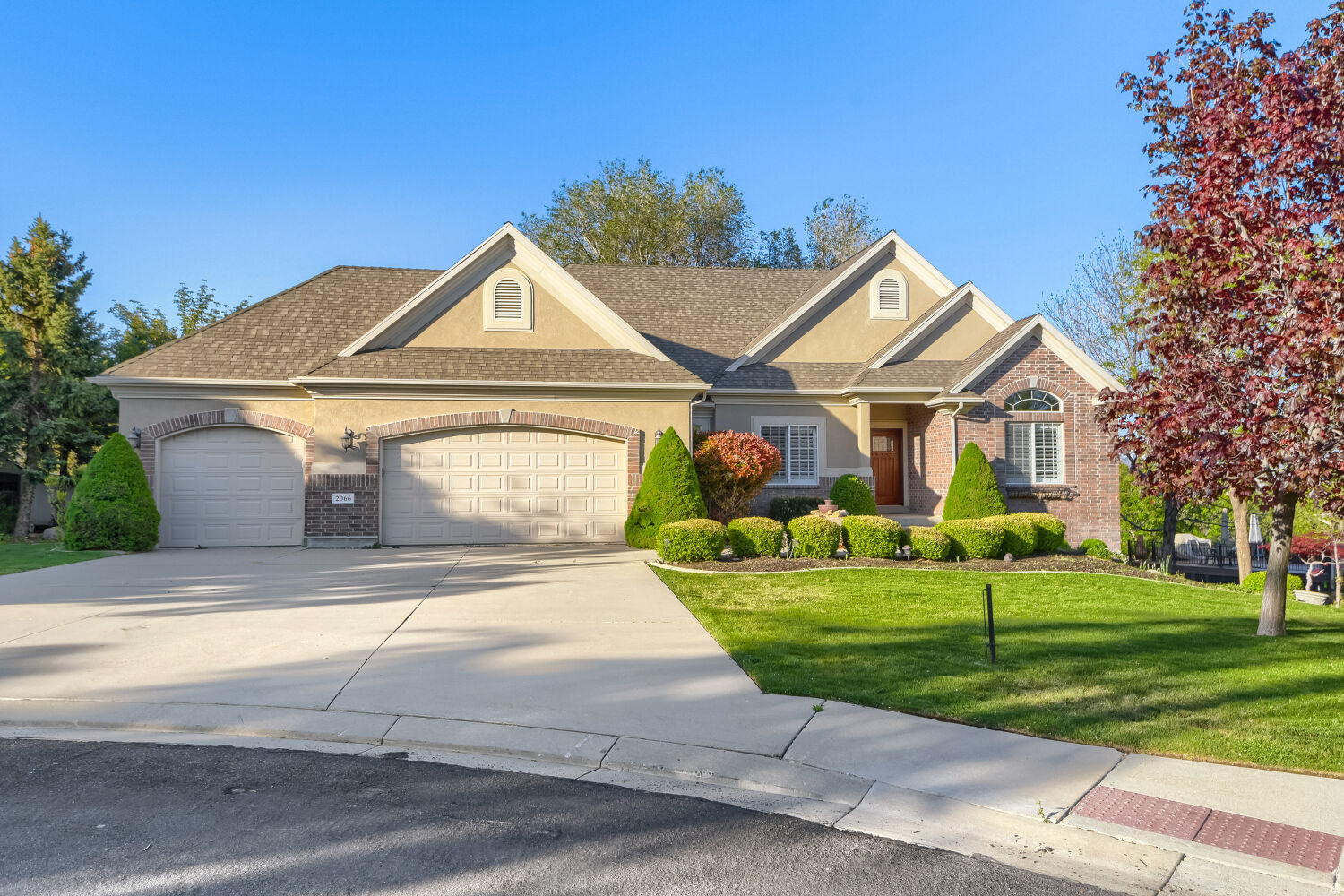 Beautiful MOTHER-IN-LAW apartment located in the highly sought-after Valle Di Villa neighborhood on Draper's east side.  This beautifully maintained rambler sits on a quiet cul-de-sac just minutes from world-class ski resorts and Hidden Valley Country Club Golf Course.  Enjoy stunning mountain views in a peaceful, established community.  The home features multiple vaulted ceilings, striking stone fireplaces, and a spacious primary suite complete with a walk-in tub for added comfort and accessibility. The walkout basement includes a fully functional apartment with its own entrance-ideal for guests, or multigenerational living.  Step outside to a beautifully landscaped yard with mature trees and a private, inviting backyard.  Square footage figures are provided as a courtesy estimate only and were obtained from county record .  Buyer is advised to obtain an independent measurement.