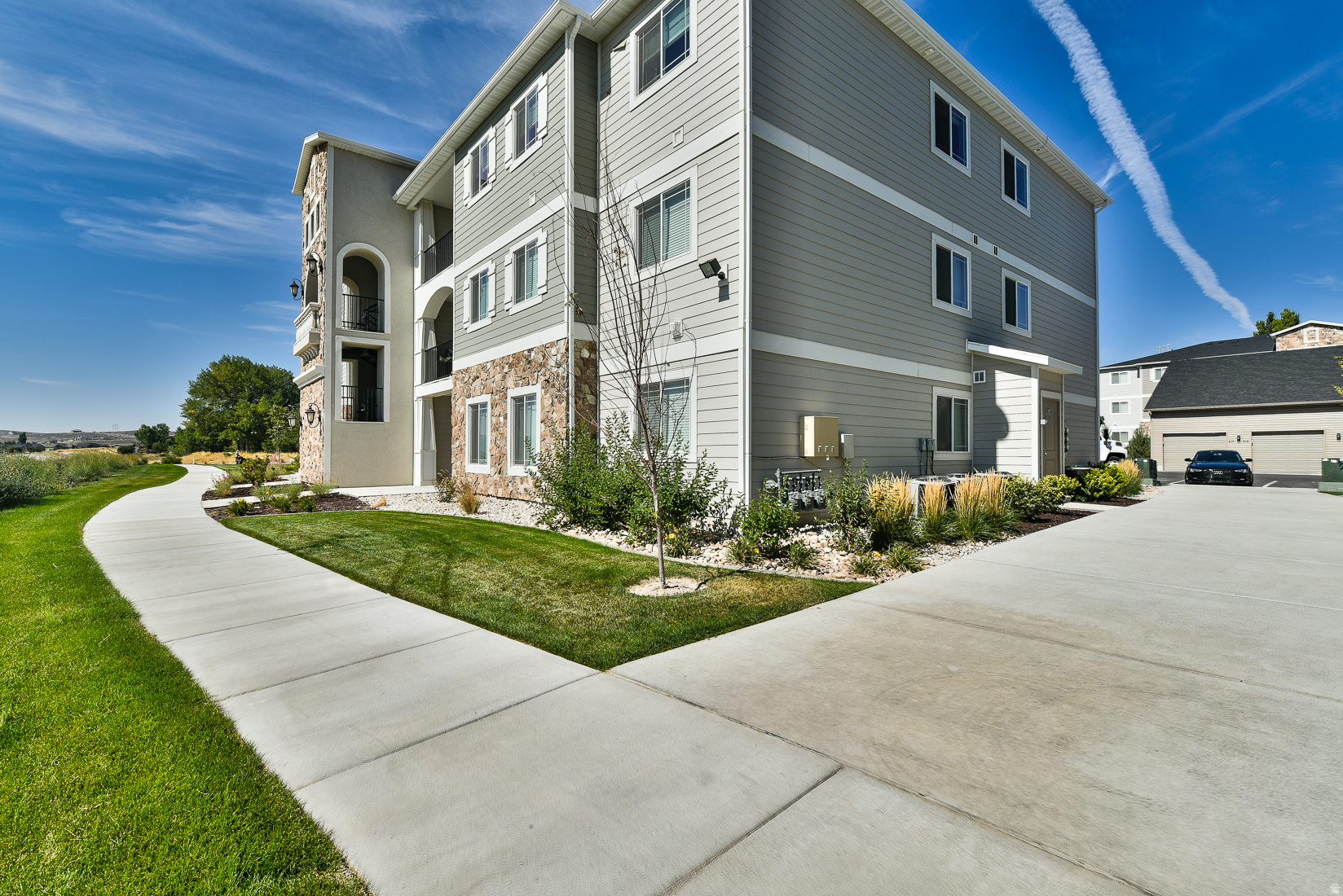 Middle unit condo with beautiful views of Utah Lake. Open floor plan with large family room that leads into the dining room and kitchen. Kitchen is complete with granite countertops, dark staggered cabinets, stainless steel appliances, and pantry. Primary bedroom with ensuite bathroom and walk in closet with built in shelving. Two additional bedrooms, full bathroom, and true laundry room. Lockable storage closet on patio. Newly remodeled clubhouse with large gathering space, pool, and gym. Internet, water, sewer, trash, and snow removal are included in the HOA. Conveniently located near lots of walking trails, shopping, entertainment, and dining. Check out the 3D tour!