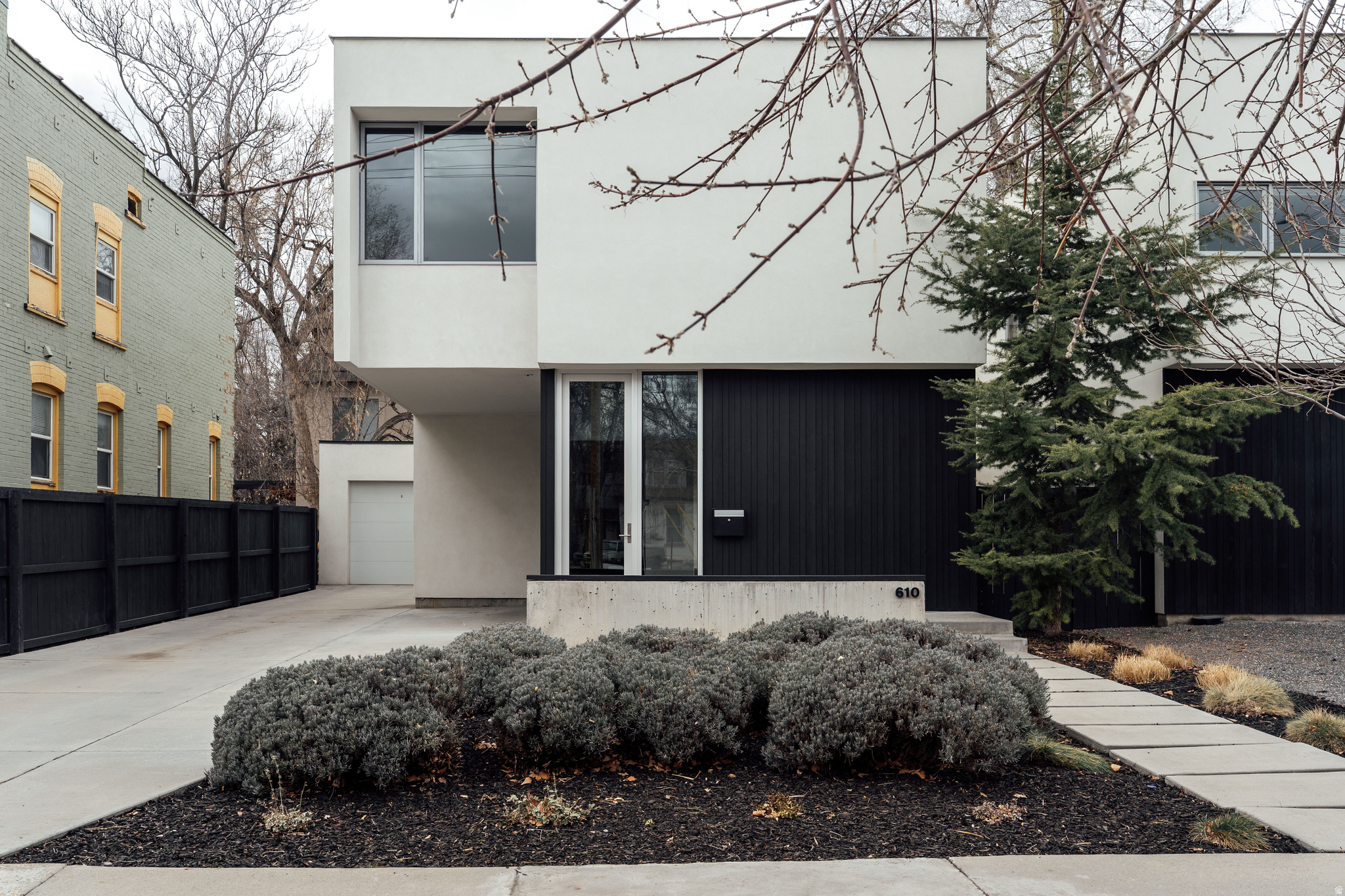 Those of us who love design and architecture know the difference between a contemporarystructurebuilt cheap for profit and an intentional home created for the enhancement of the inhabitants. This house is well proportioned, intelligently drafted and crafted, and simple in its beautiful function. I love being impressed when it comes to home. This gem has sat on that list for a long while-homes that get it right when it comes to small lots, low maintenance, and city living. Maximizing livabilitywithin a reasonable footprint, this house could be a course.And the space does all the teaching, no words needed. But in case you want a few details, here are some from my friend and colleague who also loves this house.  "Right in the center of it all, yet quietly tucked into its own rhythm, this modern retreat delivers clean lines, thoughtful design, and effortless living. Built in 2014, the home still feels new-roof, systems, and appliances all in excellent condition-offering peace of mind wrapped in polished style.Inside, tall ceilings (9' throughout) and an airy open-concept main floor create a sense of volume and light that feels both expansive and inviting. The kitchen, dining, and living spaces flow seamlessly together -- anchored by custom cabinetry, quartz countertops, and high-end finishes that elevate everyday living. A 12-foot sliding glass door stretches across the back wall, blurring the line between indoors and out and filling the space with natural light.Upstairs, three well-proportioned bedrooms provide privacy and comfort. The primary suite feels intentional and refined, while a convenient half bath on the main floor makes hosting easy.Xeriscaped landscaping keeps maintenance minimal and weekends wide open. A one-car garage offers rare extra parking for this ultra-central location.Modern. Connected. Move-in ready.This is an oasis in the city-designed for living well." -- Jennifer Hadfield And in case you are wondering if a move is necessary, a new lifeready here atthis stable structure, there is indeed a fireplace to keep you warm when modernism feels ready for the heat. Cool is great, but a good house is also hot.