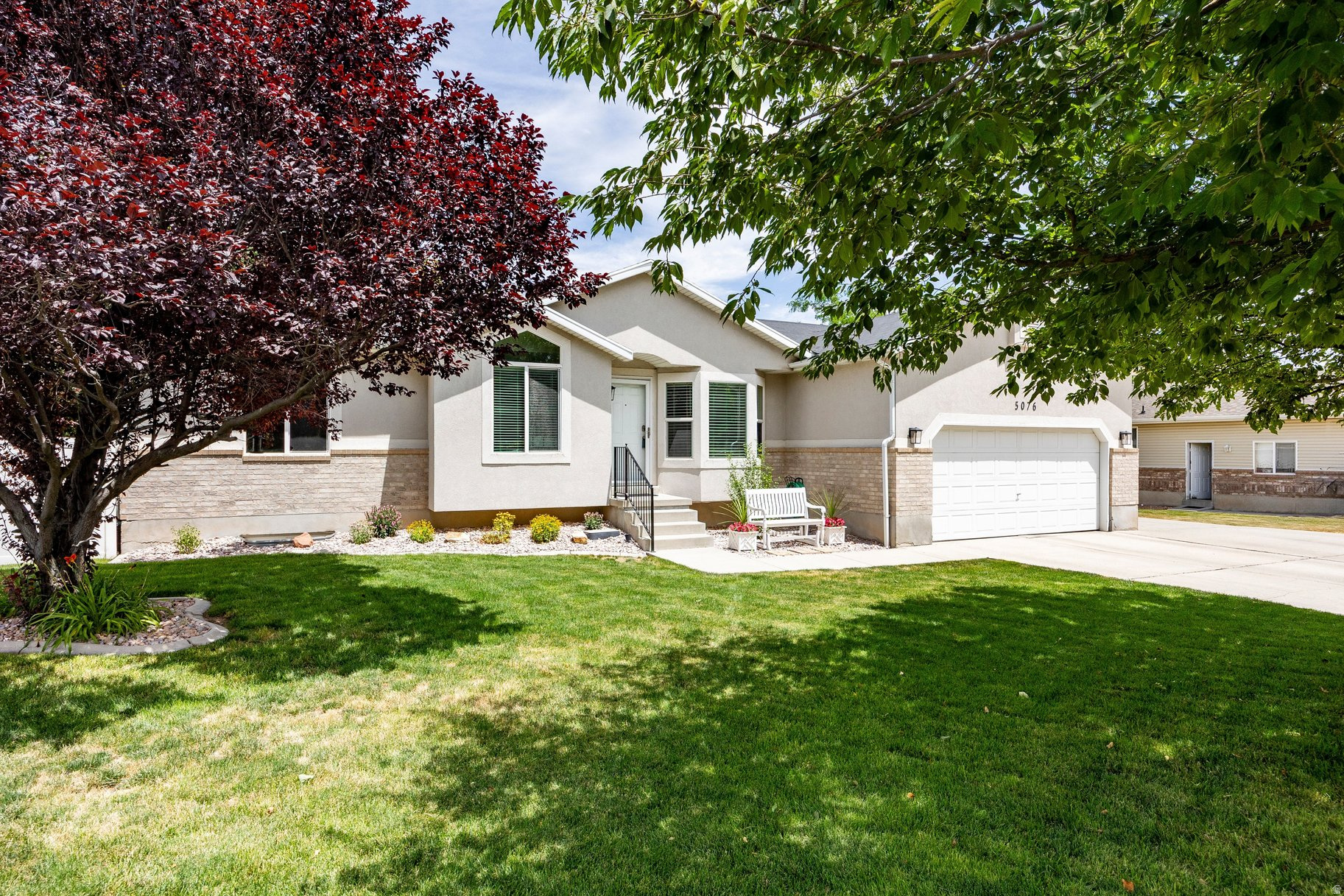 Welcome to this beautifully maintained 5-bedroom, 3-bathroom home nestled in a desirable West Jordan neighborhood. Built in 2000, this light-filled residence offers a thoughtfully designed floor plan with soaring vaulted ceilings and inviting living spaces that are perfect for both everyday living and entertaining. The beautifully appointed main-floor primary suite is perfectly situated for comfort and privacy, featuring an ensuite bathroom and walk-in closet. New flooring throughout the main living areas, adding a fresh, modern touch, while large windows fill the home with an abundance of natural light. Enjoy peace of mind with major updates already completed, including a new furnace and air conditioner in 2023. Both upstairs bathrooms were tastefully remodeled in 2023 with new flooring, cabinetry, countertops, and toilets, creating stylish, move-in-ready spaces. Step outside to an expansive backyard designed for entertaining, complete with a large patio, cozy fire pit, and plenty of room to enjoy Utah's beautiful seasons. The oversized lot also features RV parking and an impressive 12' x 20' storage shed, providing exceptional space for tools, toys, hobbies, or additional storage. Combining comfort, functionality, and thoughtful updates, this move-in-ready West Jordan home offers the perfect balance of indoor and outdoor living.
