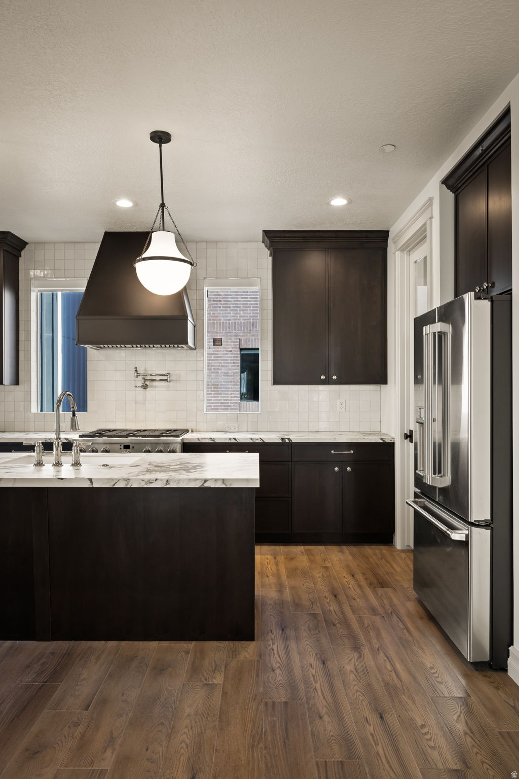 Discover sophisticated urban living in the heart of Salt Lake City's historic Marmalade District at theIRIS Luxury Townhomes. The Franklin B plan offers 3 bedrooms, 23 bathrooms, and flexible living space across three thoughtfully designed levels. Enjoy open-concept interiors with curated designer finishes, tall ceilings, and abundant natural light. Each home includes a spacious 2-car garage, energy-efficient systems, all appliances, window treatments and a low-maintenance lifestyle with HOA services covering landscaping, snow removal, water, sewer, and trash. Modern design details make theIRIS a rare opportunity to experience both comfort and convenience. Located just minutes from downtown dining, shopping, and cultural attractions, theIRIS places you at the center of it all while offering a private retreat to call home.