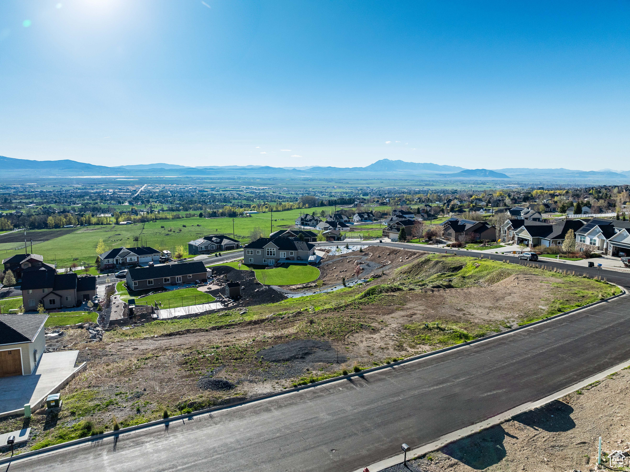 Set on North Logan's sought-after east bench, this homesite captures sweeping views of the valley, surrounding mountains, and USU's iconic Old Main. Opportunities to build in this quiet, established neighborhood are becoming increasingly limited-making this lot a rare find. Enjoy direct access to the Bonneville Shoreline Trail, stretching from Hyde Park to Hyrum, perfect for hiking, biking, and taking in the scenery. Utilities are already stubbed to the property. North Logan City requires geotech studies to build on this lot!