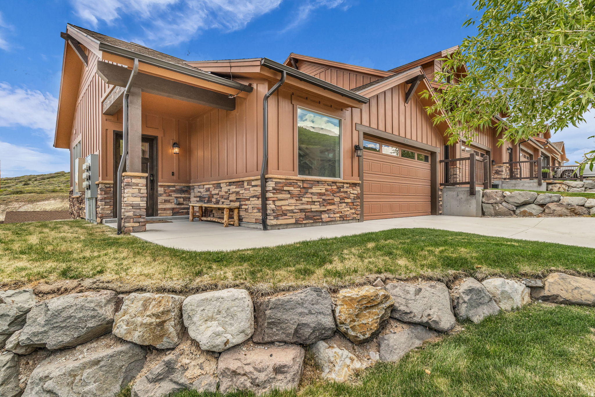 Located in the final and most desirable phase of Black Rock Ridge, this beautifully appointed 3-bedroom  End- Unit townhome offers one of the premier locations within the entire community. Perched on a downhill homesite at the top of a quiet cul-de-sac, the residence enjoys unobstructed panoramic views stretching toward Park City's surrounding ski resorts and mountain ranges. Completed in 2022, the home features Black Rock Ridge's most popular floorplan, designed for comfortable main-level living and effortless entertaining. Thoughtfully upgraded throughout, the residence showcases Viking appliances, quartz countertops, hardwood flooring, two fireplaces, and a home theatre for extra entertaining space. Black Rock Ridge is ideally positioned just minutes from the new Deer Valley East Village, Jordanelle Reservoir, Park City Historic Main Street, world-class skiing, dining, golf, hiking, and biking. Miles of nearby trails connect residents to year-round recreation, while Salt Lake City International Airport is conveniently located approximately 40 minutes away.