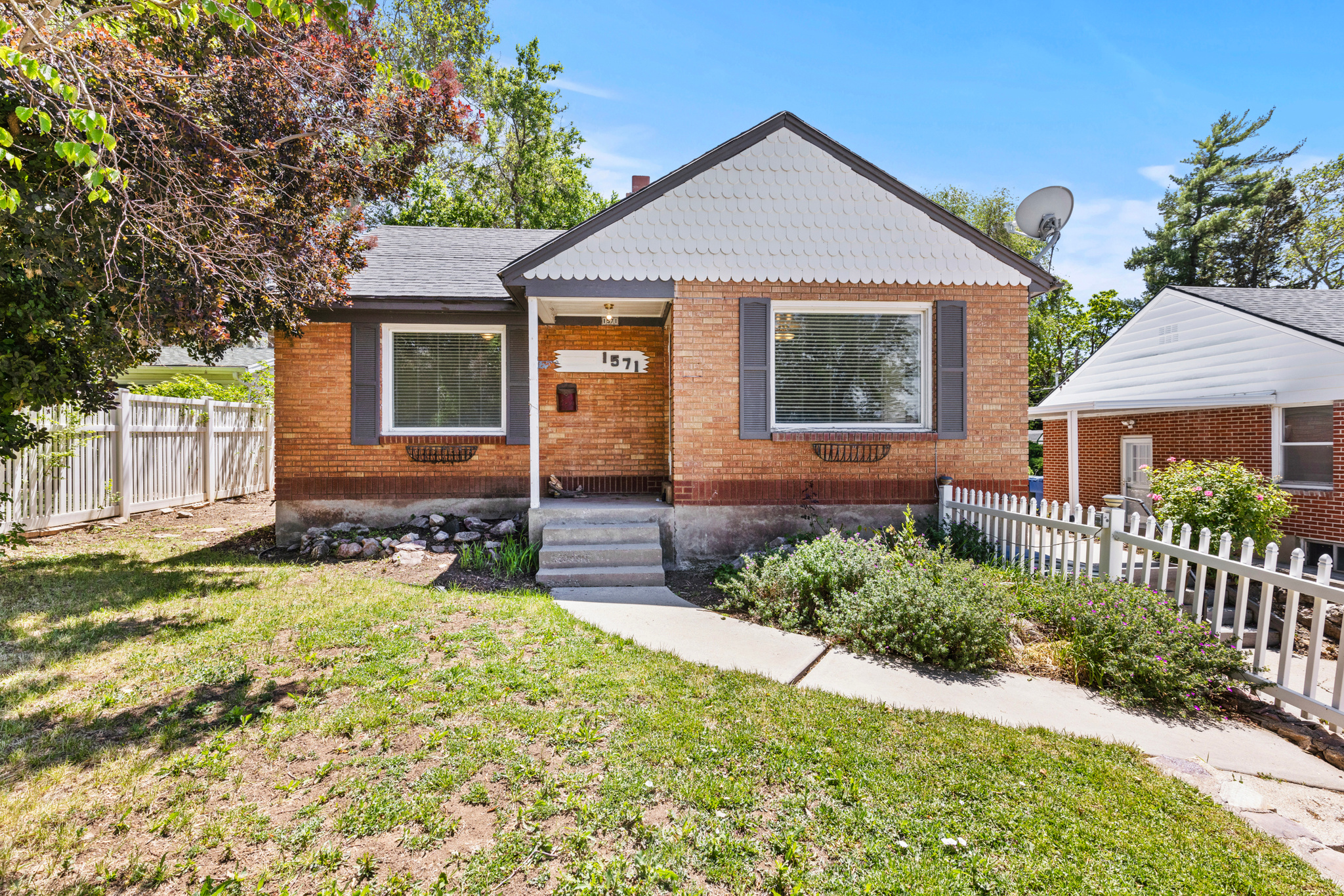 Rare East Bench opportunity with an assumable 3.1% loan! Located near the Ogden Shoreline Trail system and close to St. Joseph Catholic School, this home offers a chance to build equity in one of Ogden's most desirable locations. Enjoy quick access to hiking, biking, and outdoor recreation while being tucked into an established neighborhood near the base of the mountains. Original hardwood floors offer the potential to restore this home into a beautiful bungalow full of character and charm. The finished basement provides additional living space and flexibility for future improvements, while the secluded backyard creates a private setting to relax, entertain, or enjoy evenings around the fire pit. Bring your ideas, your toolbox, and your vision. Whether you're looking to build sweat equity, tackle your next project, or create a long-term home in a highly sought-after East Bench location, this property offers tremendous upside and is priced to reflect the opportunity.