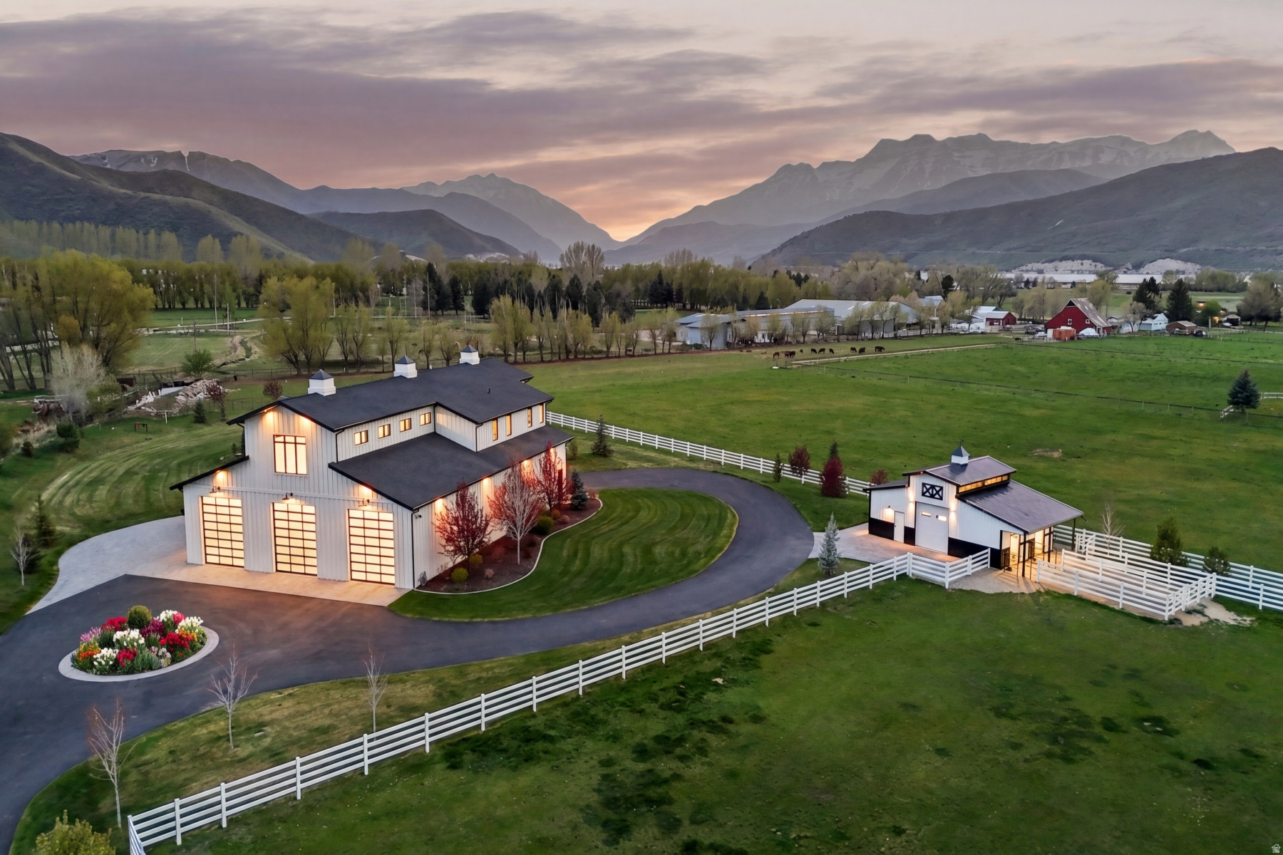 Set on 3.5 private acres in Charleston, Utah with Mount Timpanogos as your permanent backdrop, this estate was built for people who live big and play hard. Whether you're hosting 50 guests poolside, parking your motorcoach after a cross-country trip, loading up the boat for a morning at Deer Creek Reservoir, or riding horses on the numerous trails nearby, Double J can accommodate all of it - from executive retreats to extended family reunions. Start with the garage: 15 vehicles, a pull-through covered RV bay with full hookups, a custom workbench, polished epoxy floors, and enough space to host a car show, a game night, or both. This isn't just storage - it's a destination. With the garage's pickleball and basketball court markings, set up the baskets or net and it's game on! When it's time to unwind, the 20' x 40' infinity-edge pool takes center stage, framing Timpanogos like a living painting. The expansive pool deck flows seamlessly between the main residence and casita, making it effortless to host a crowd or disappear for a quiet evening by the fire pit and hot tub. The pool house adds a bedroom, bathroom, and outdoor shower, so guests never have to go far. Together, the main home and casita offer over 4,300 square feet of refined living space, finished with top-of-the-line appliances, custom cabinetry, and elevated details throughout. For those with horses or recreational equipment, the property delivers: a dedicated barn, multiple paddocks, and a loafing shed round out the ranch side of the lifestyle. And when adventure calls beyond the gates? World-class ski resorts, championship golf, blue-ribbon fishing, and miles of backcountry trails are all within a short drive - with Deer Creek Reservoir just a walk away. Double J Ranch isn't just a property. It's the life you've been building toward.